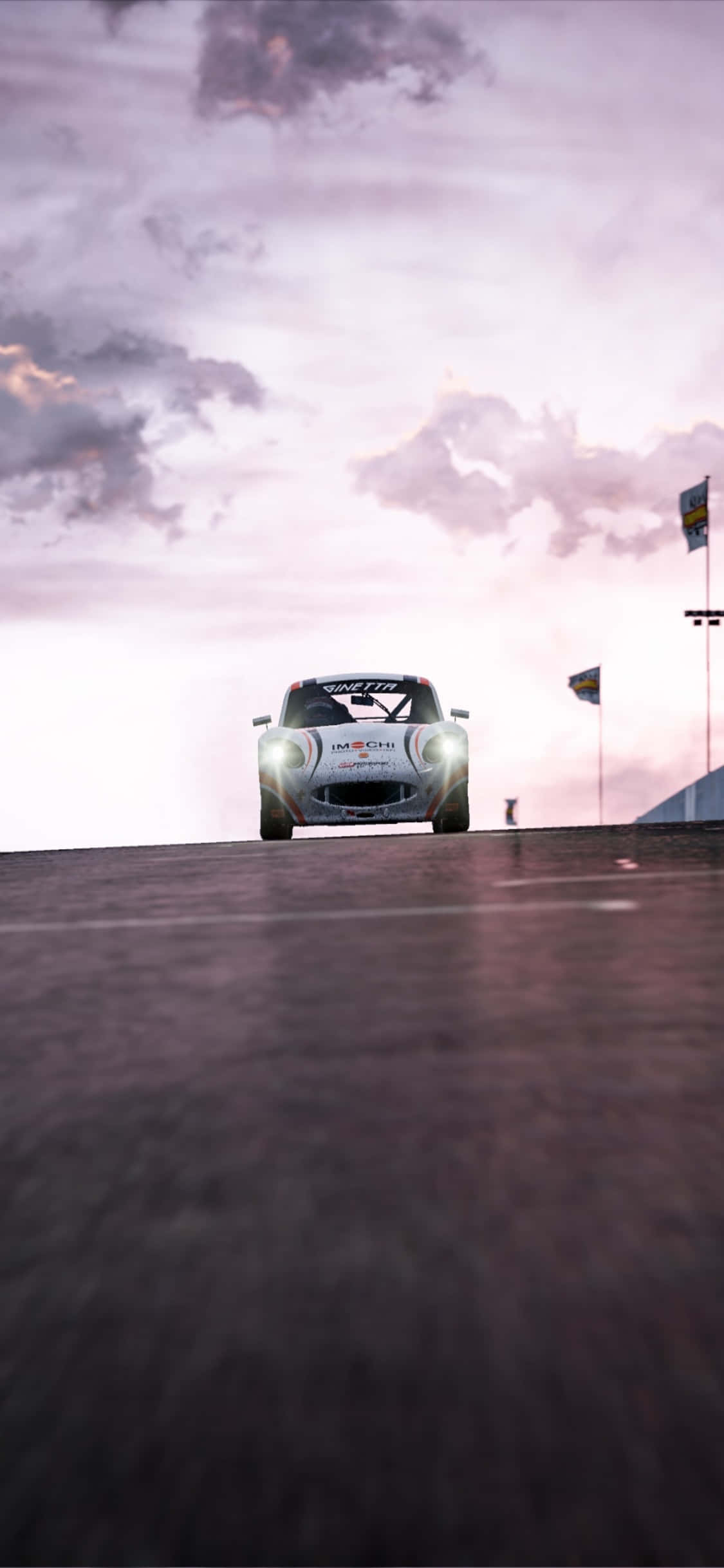 isang kotse na nagmamaneho sa isang track Wallpaper