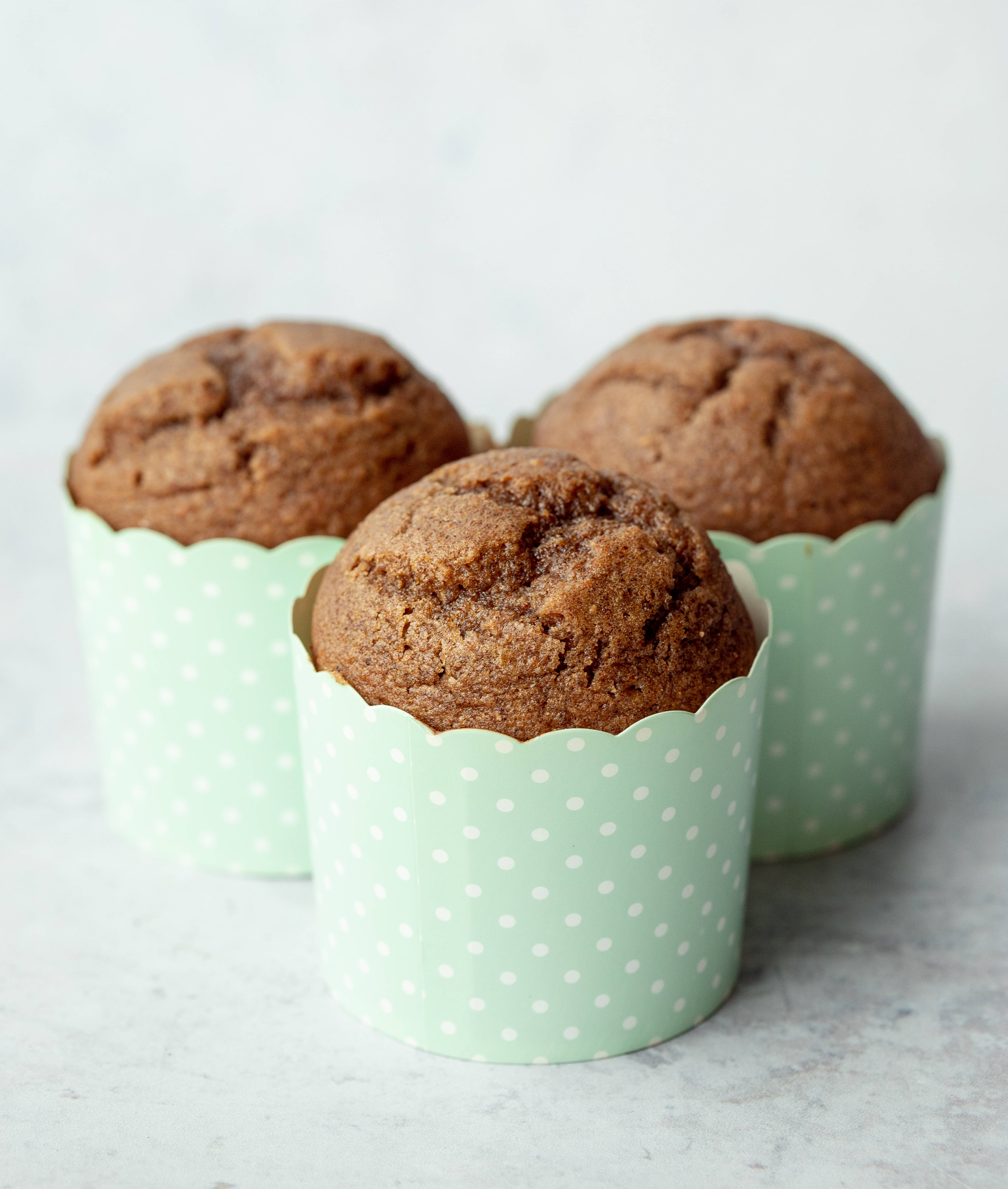 An Array of Delectable Muffins in Polka Dot Cups Wallpaper