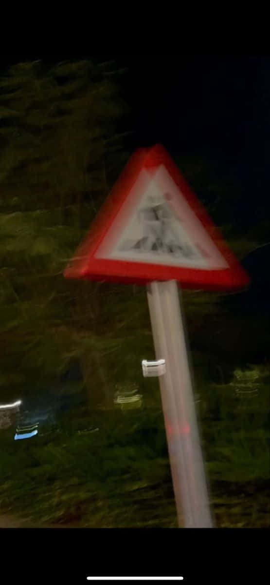 Blurry Crossing Sign Night Time Picture Wallpaper