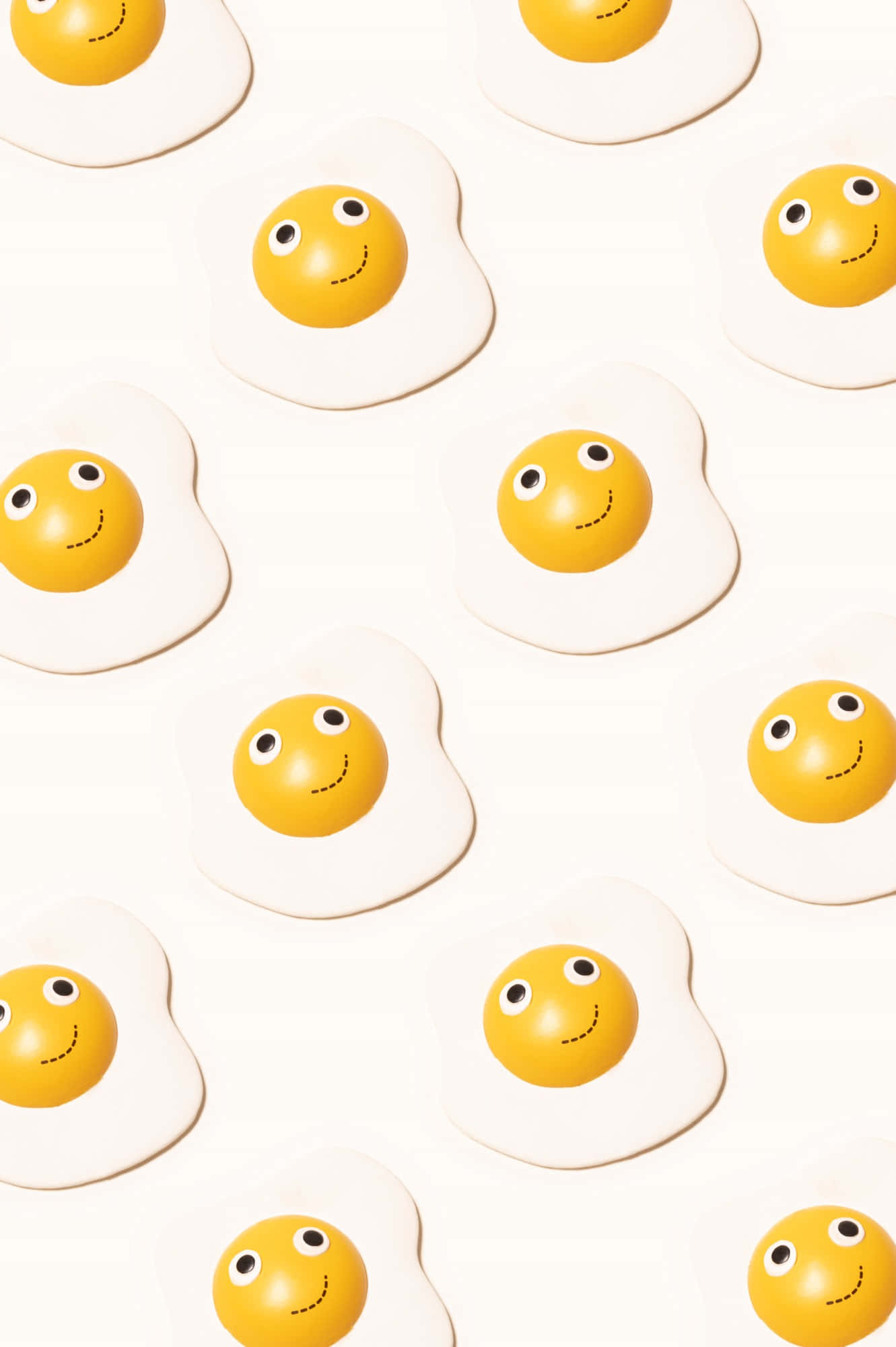 Caption: A Lively Smile Emoji Blended with Sunny Side Up Egg Wallpaper