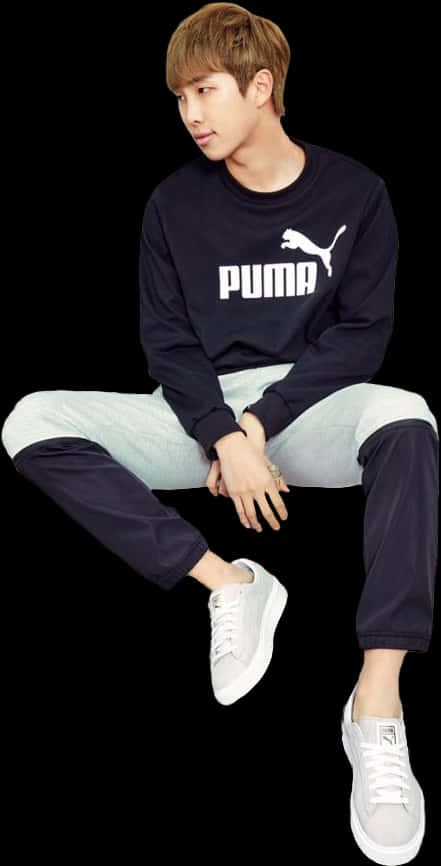 Casual na Puma Outfit na Nakaupo Wallpaper