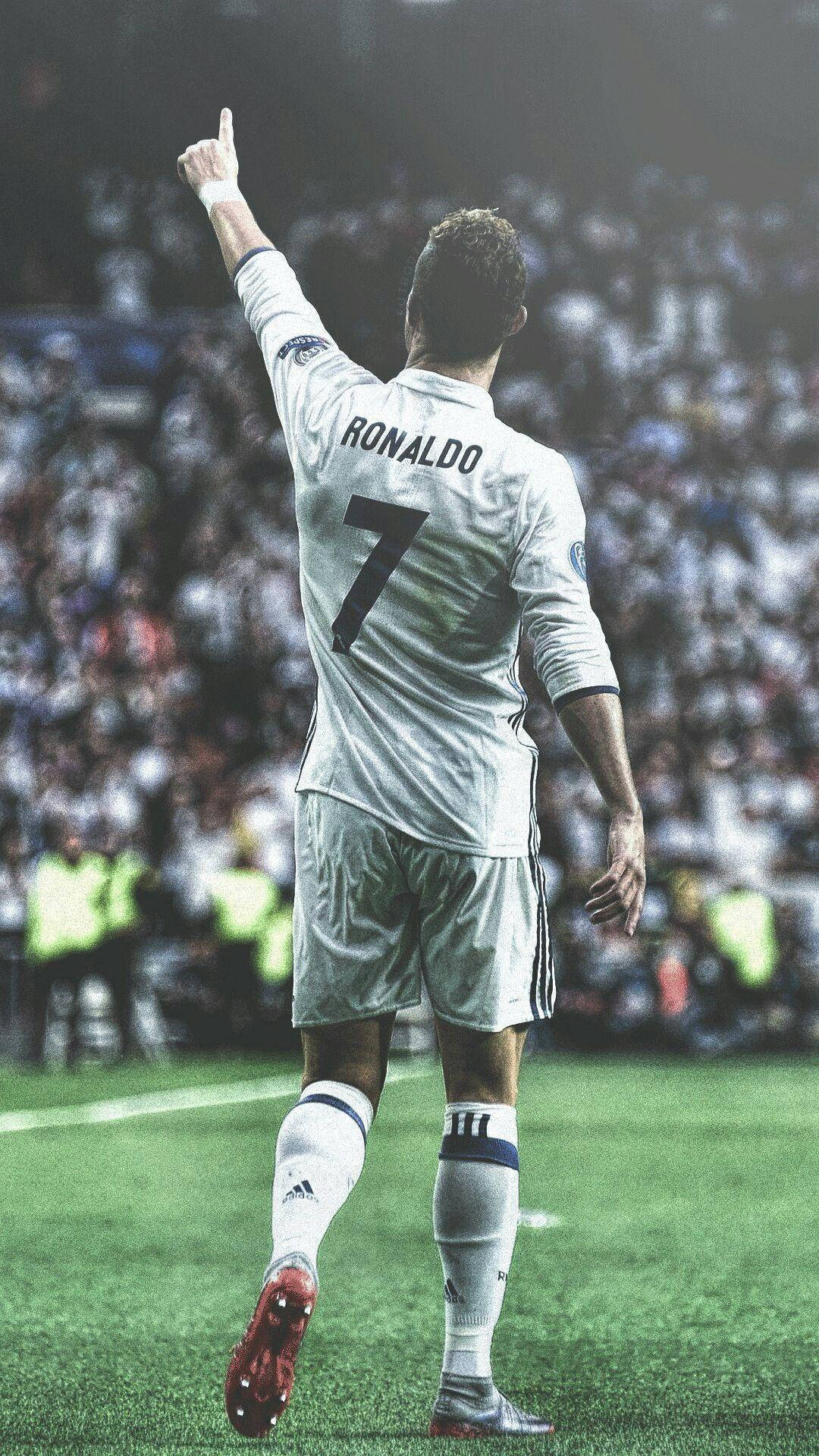 Cristiano Ronaldo na iPhone na Nakaturo Paakyat Wallpaper