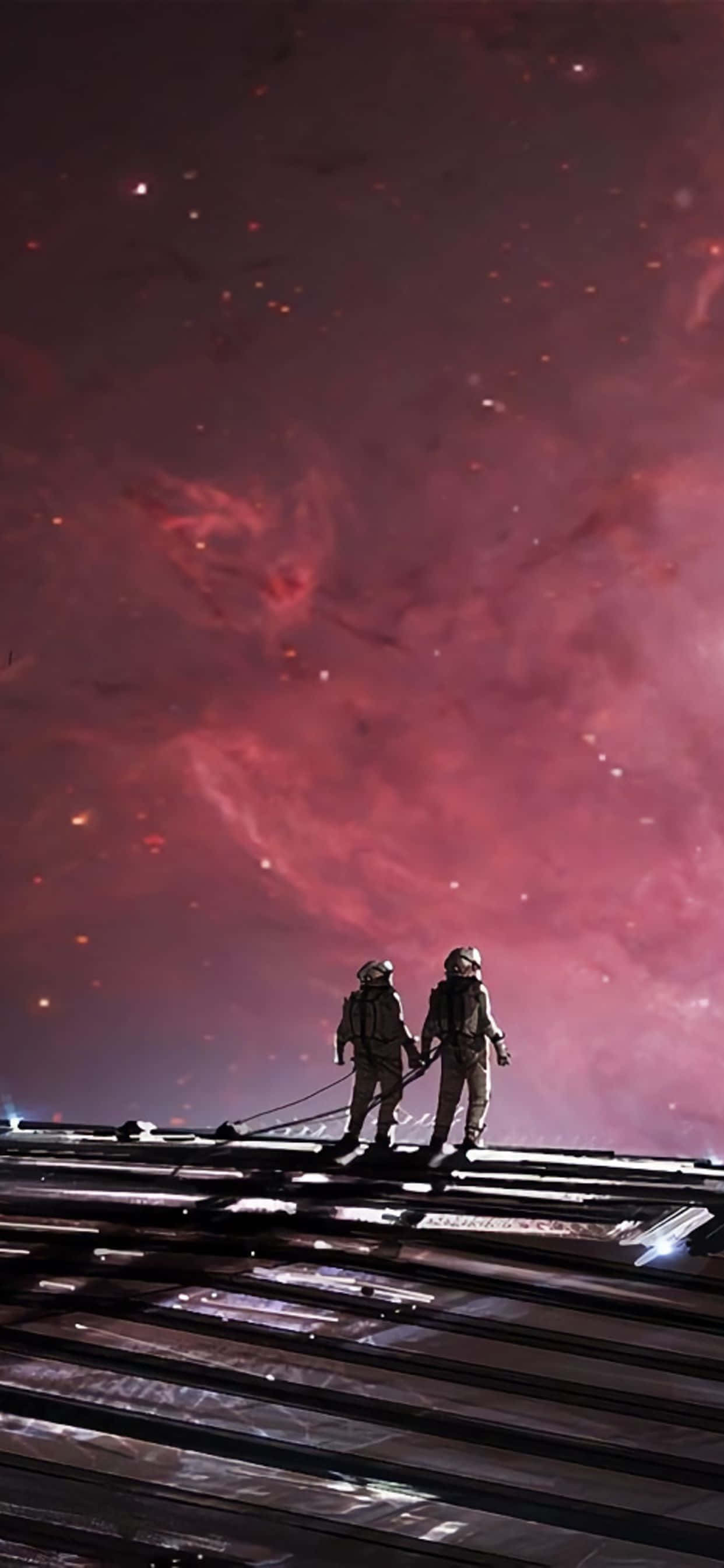 dalawang astronaut na naglalakad sa isang tren track na may rosas na langit Wallpaper