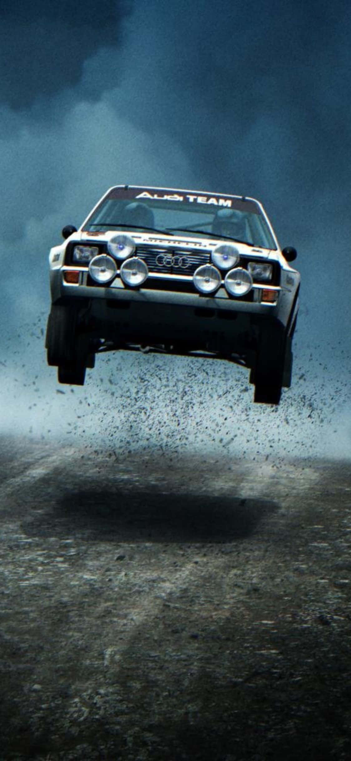 Damhin ang Rush ng Excitement kasama ang iPhone Xs Dirt Rally Wallpaper