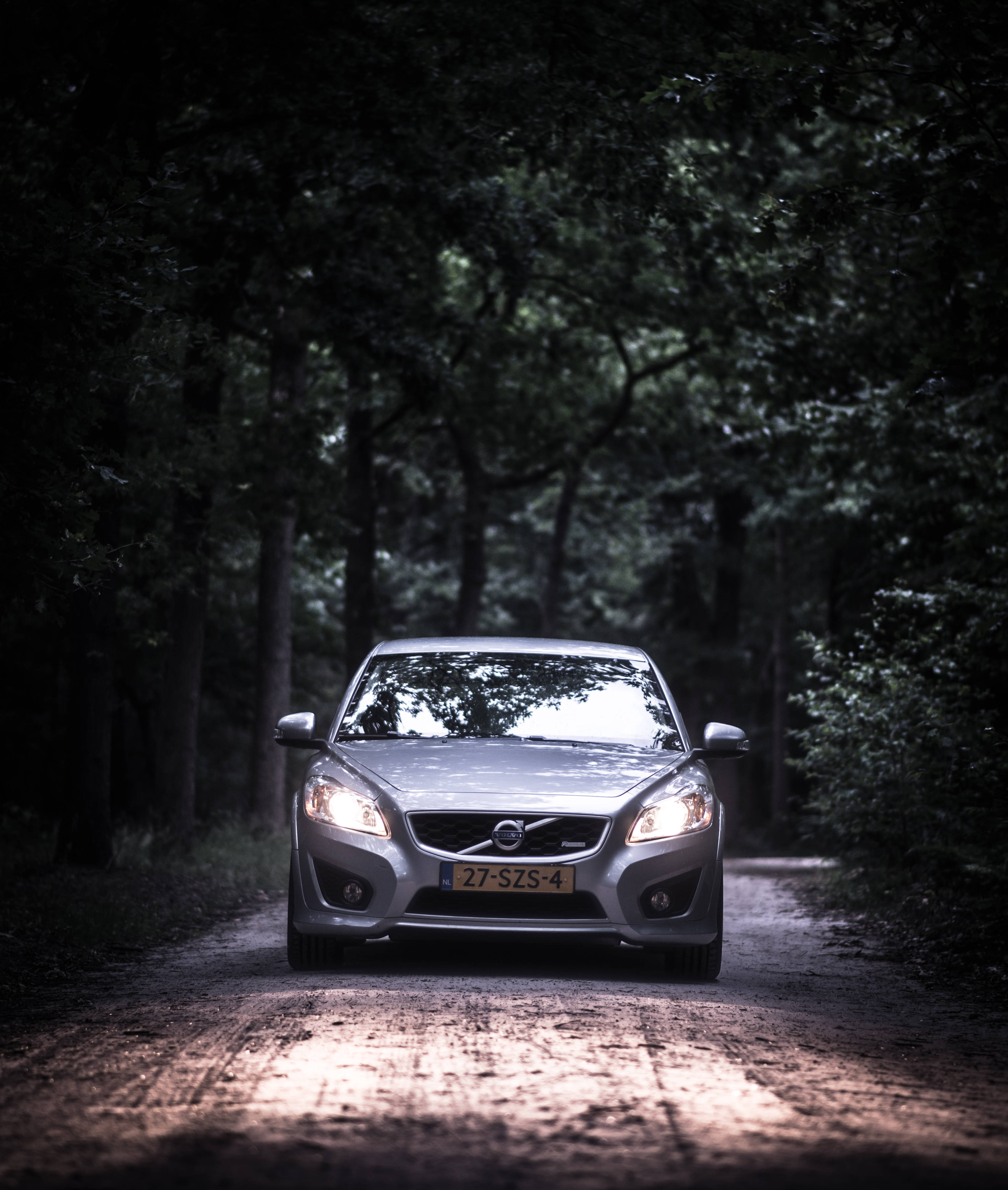 Driving Gray Volvo Sedan Wallpaper