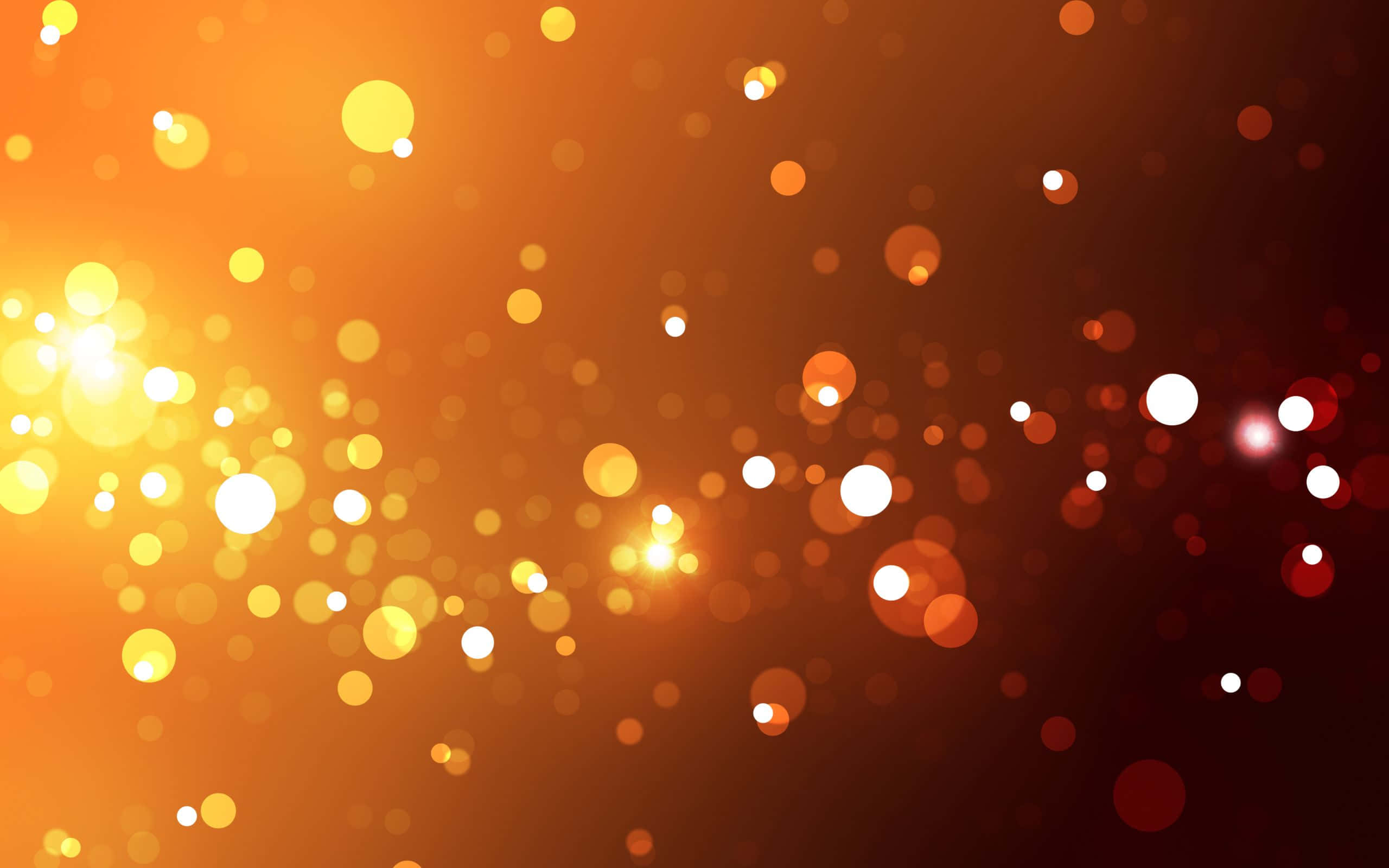 Epektong Bokeh sa Itim at Kahel na Background Wallpaper