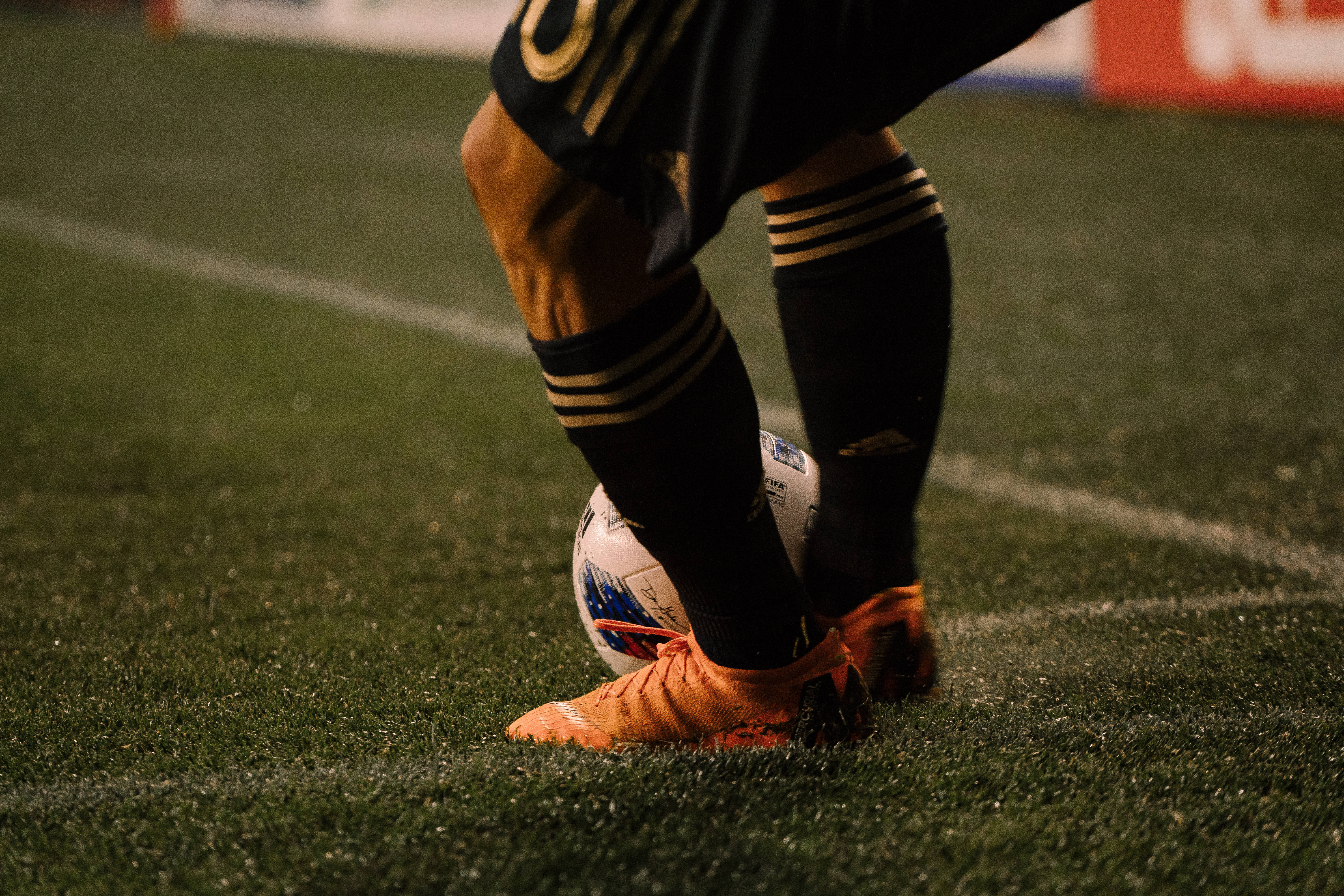 Football Cleats na Manlalaro ng Football Wallpaper