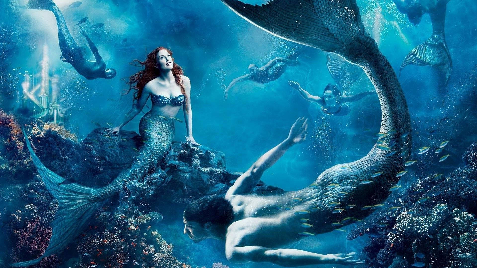 Grupo ng masasayang sirena na lumalangoy sa ilalim ng tubig Wallpaper