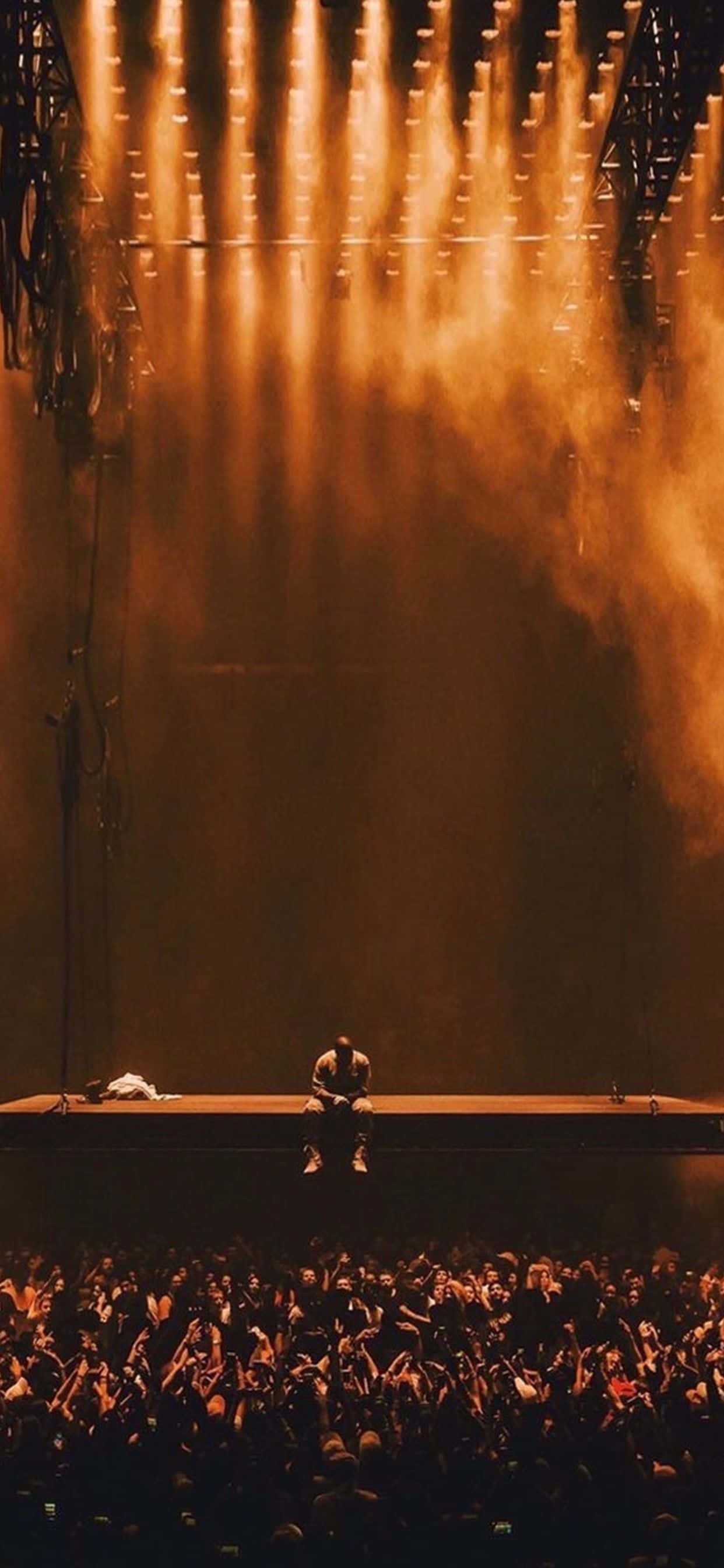 Iconic Rapper Kanye West Sa Thoughtful Pose Wallpaper