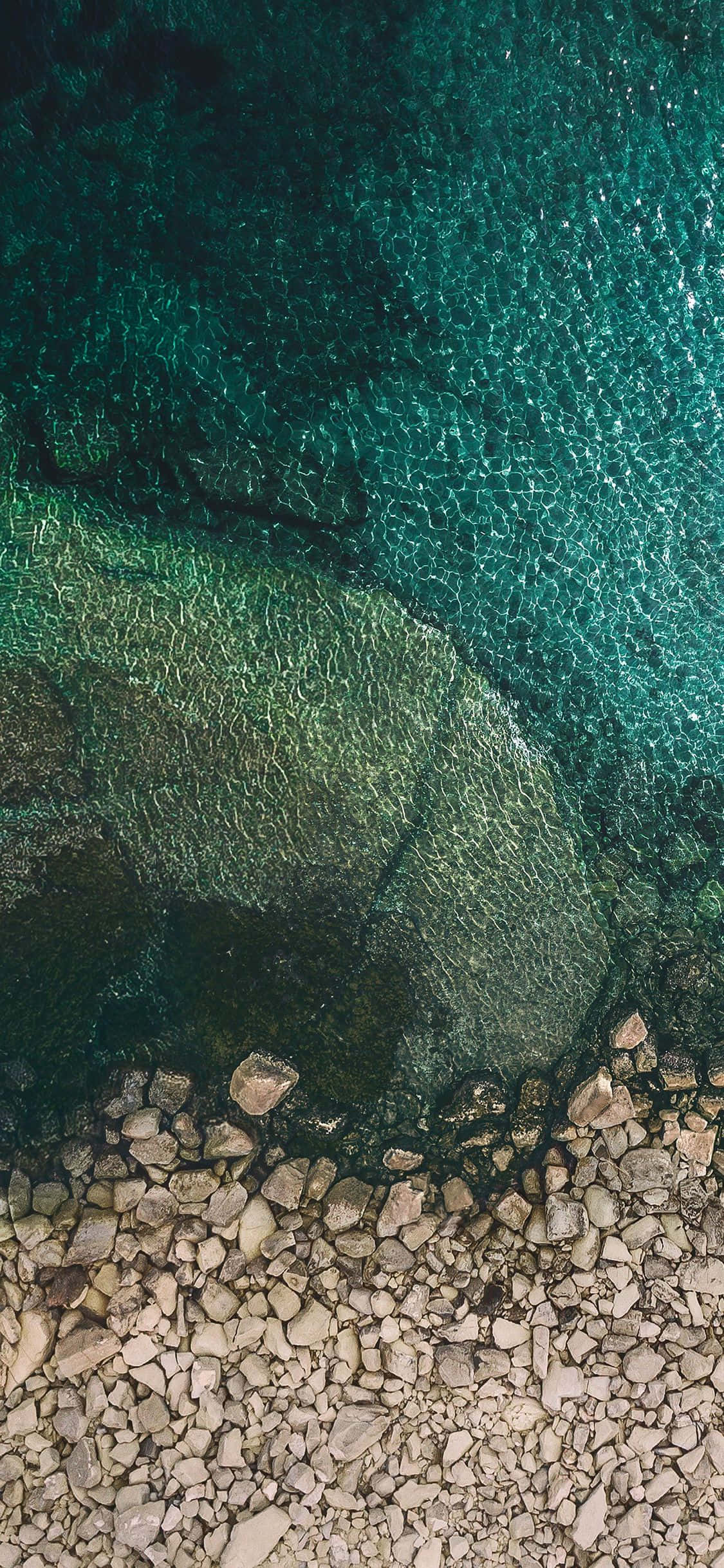 iOS 1 Rocky Seaside Wallpaper