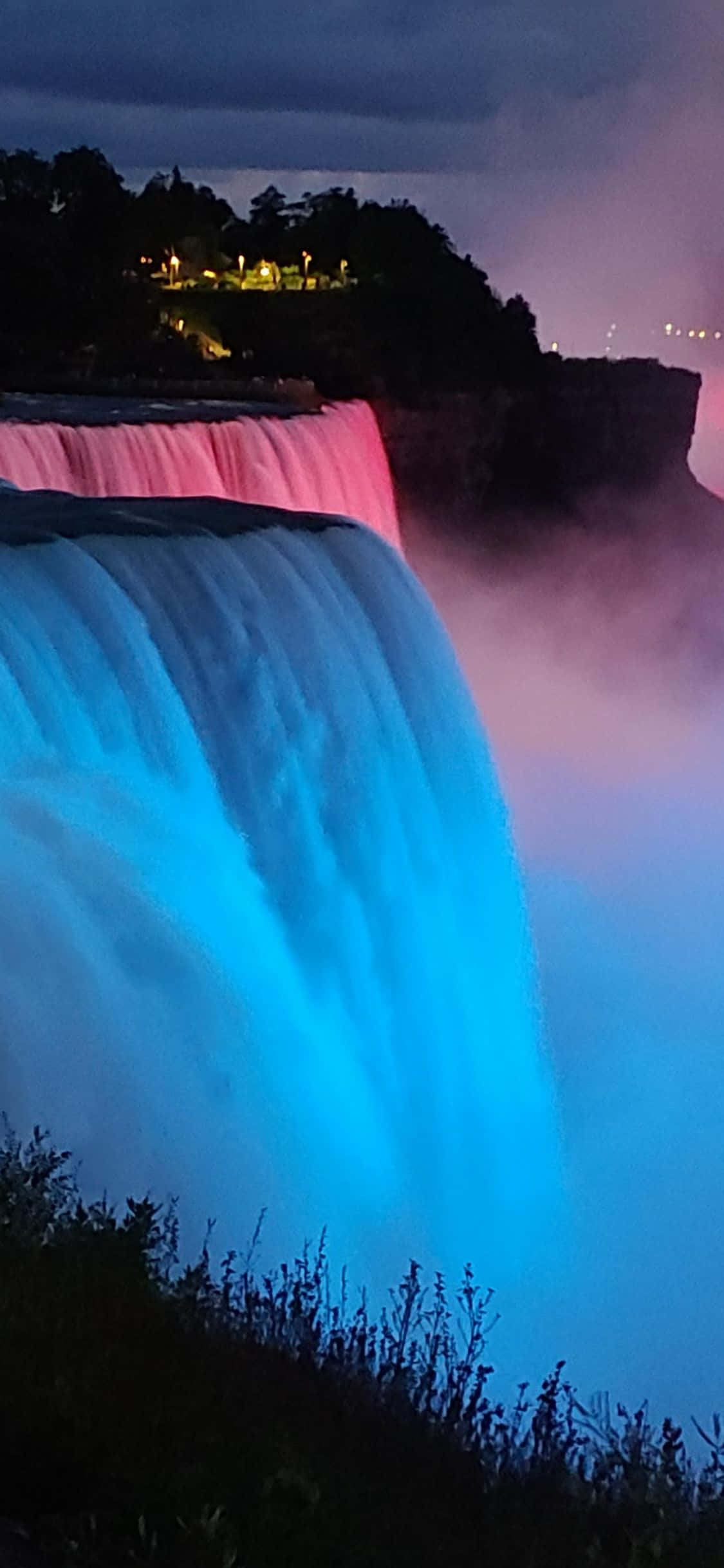 iPhone X Blue Lit Niagara Falls Background Wallpaper