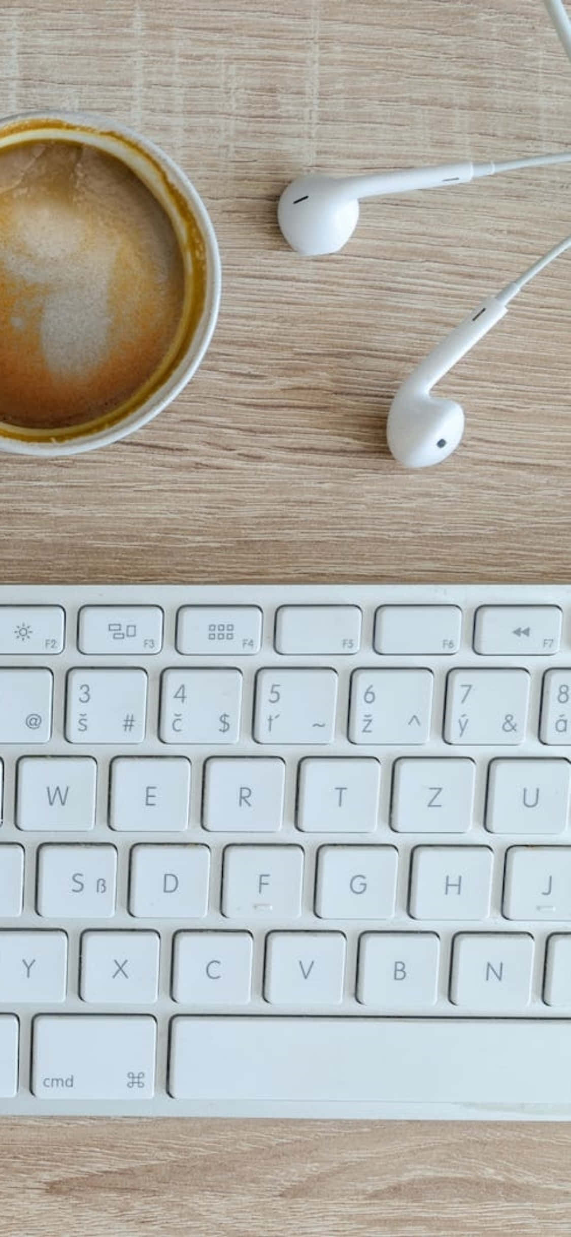 iPhone X Desk Background Earphones At Keyboard Wallpaper