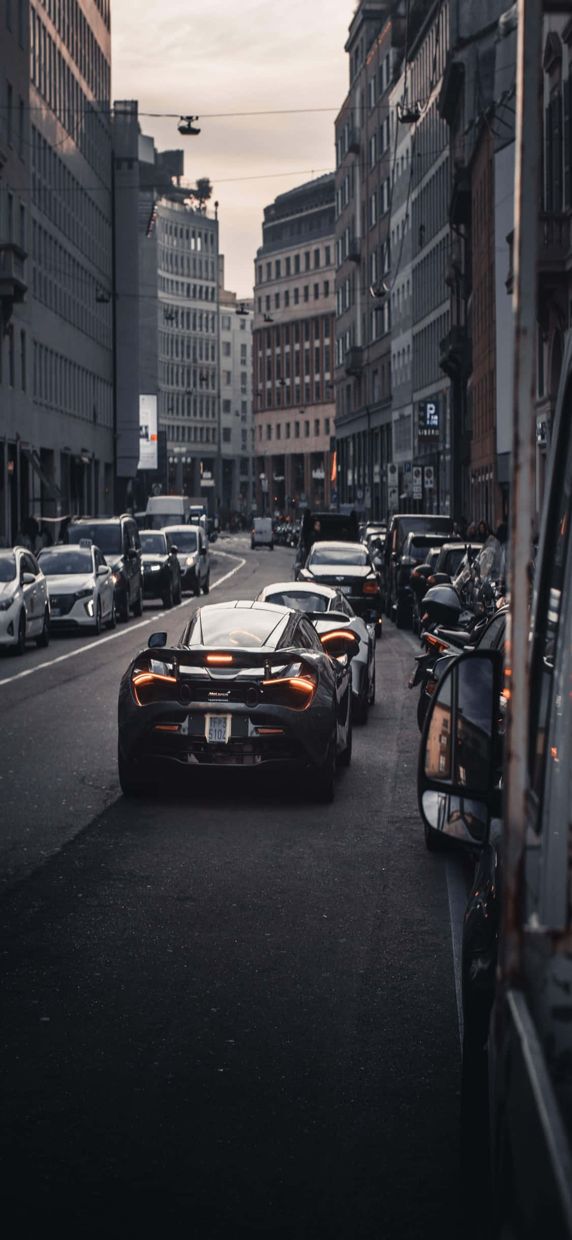 iPhone X Mclaren 720s City View Background Wallpaper