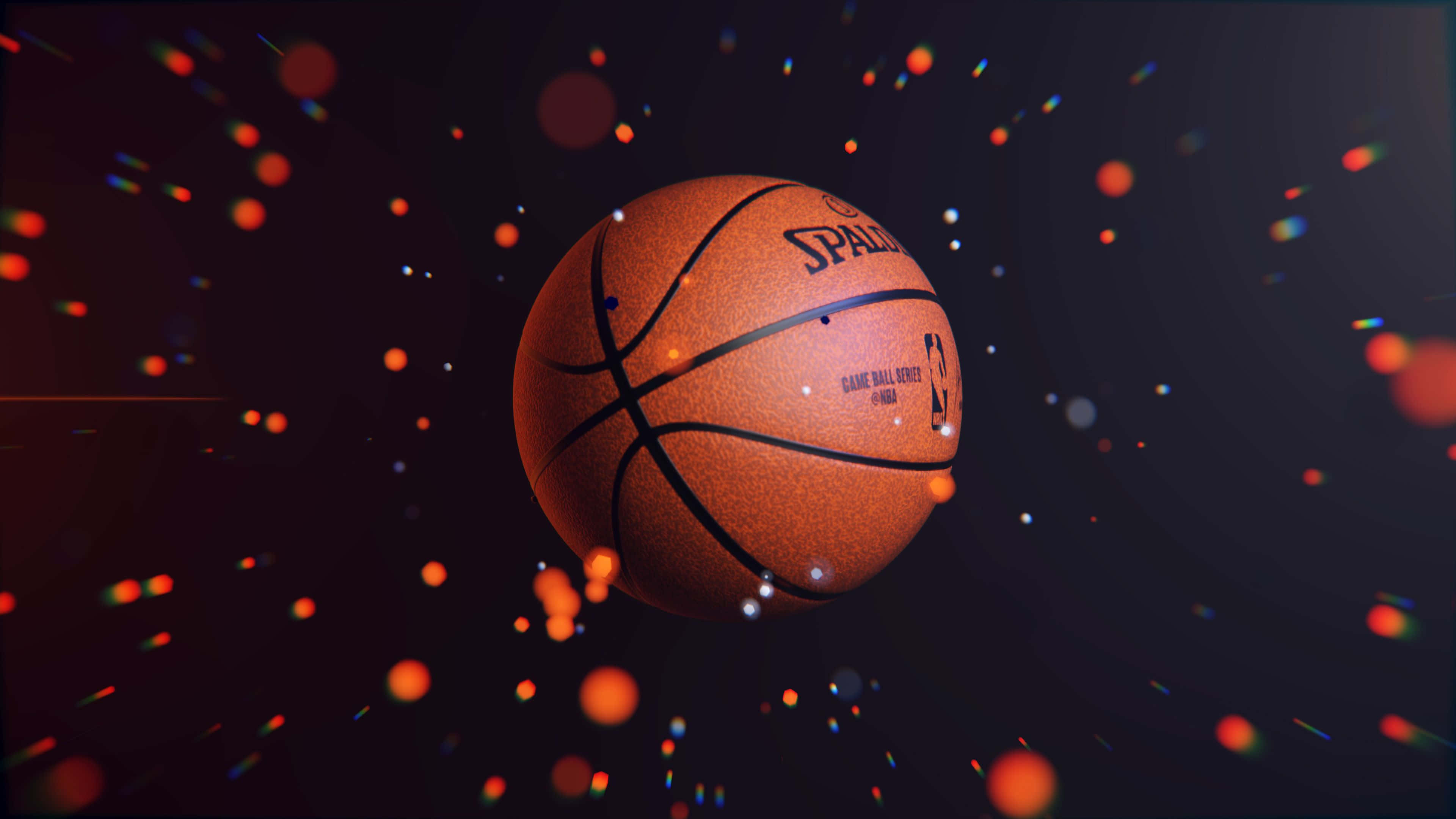 isang basketball na may orange at pulang ilaw Wallpaper