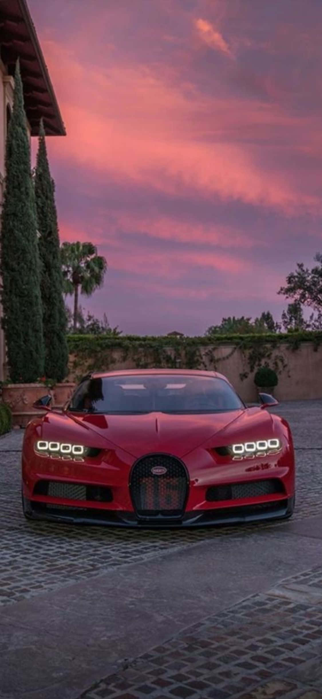 Isang iPhone Xs na may marangyang Bugatti background Wallpaper