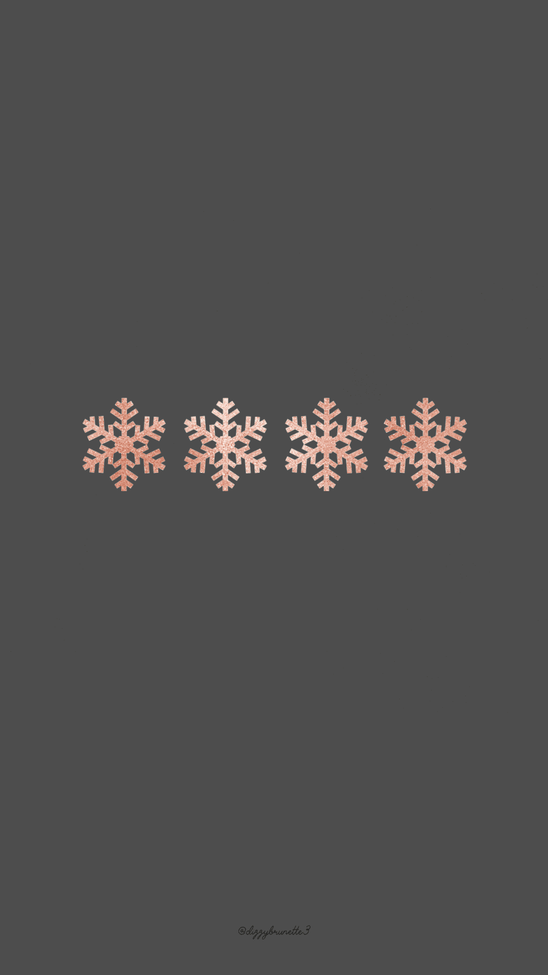 Isang kulay abong background na may mga snowflake dito Wallpaper