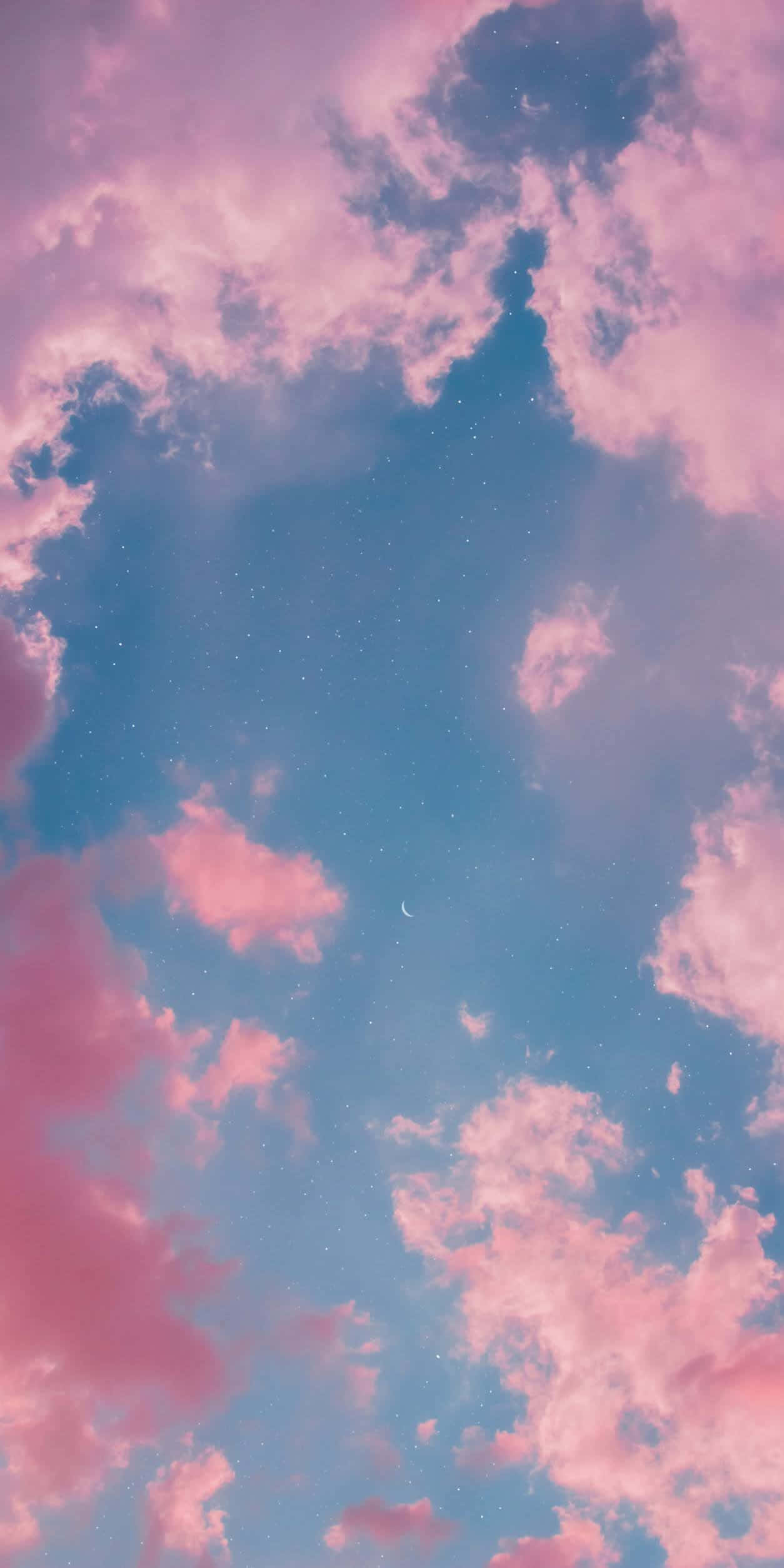 isang kulay rosas na langit na may mga ulap at buwan Wallpaper