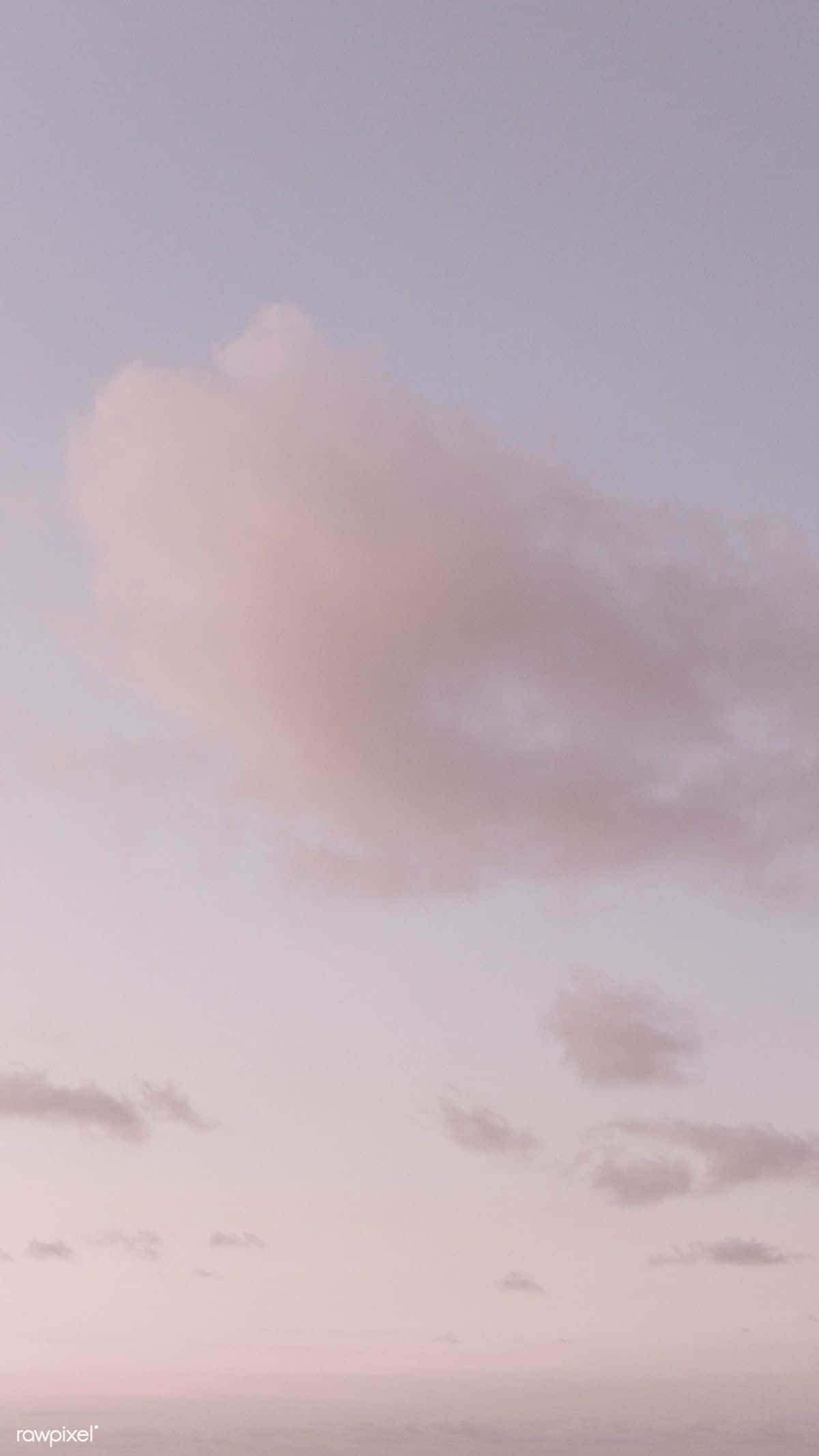 Isang lalaki ang nagpapalipad ng saranggola sa kalangitan Wallpaper