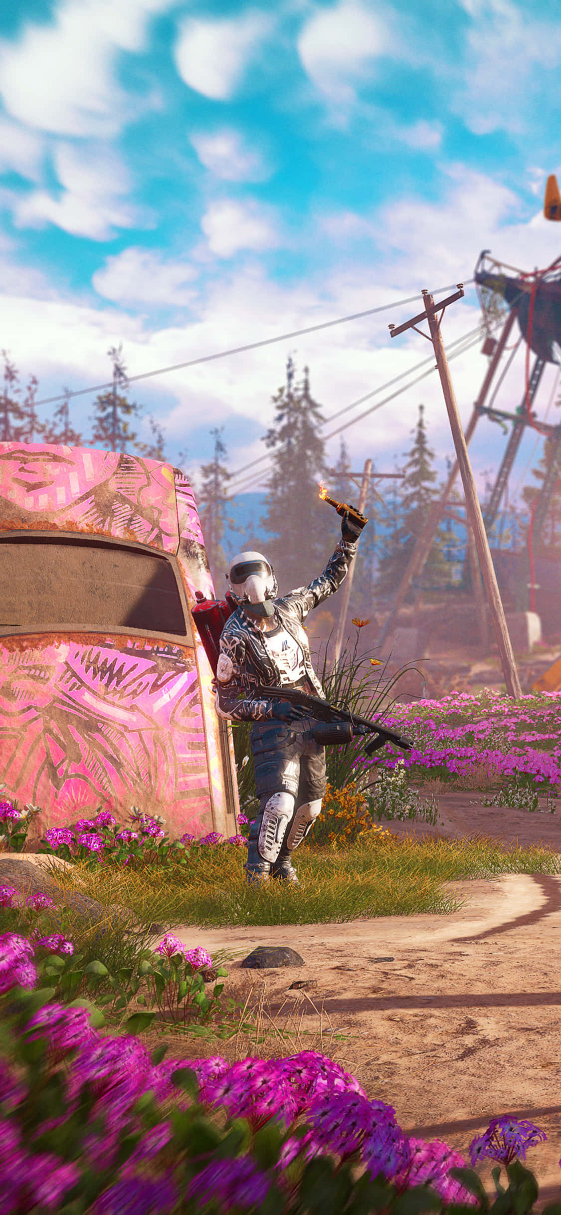 isang lalaki ay nakatayo sa harap ng isang pink na bulaklak na bukid Wallpaper
