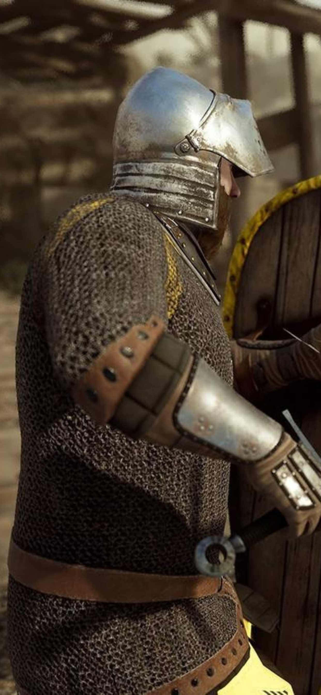 isang lalaki sa medieval armor ay naghahawak ng shield Wallpaper