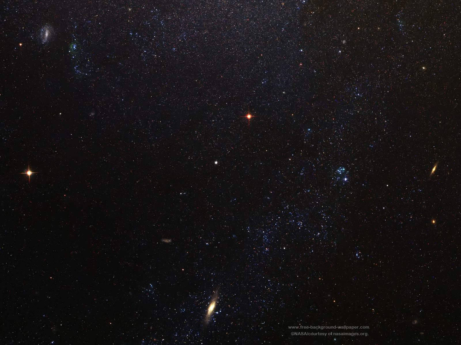 Isang magandang spiral galaxy na may mga bituin na nakakalat sa malawak nitong kalawakan Wallpaper