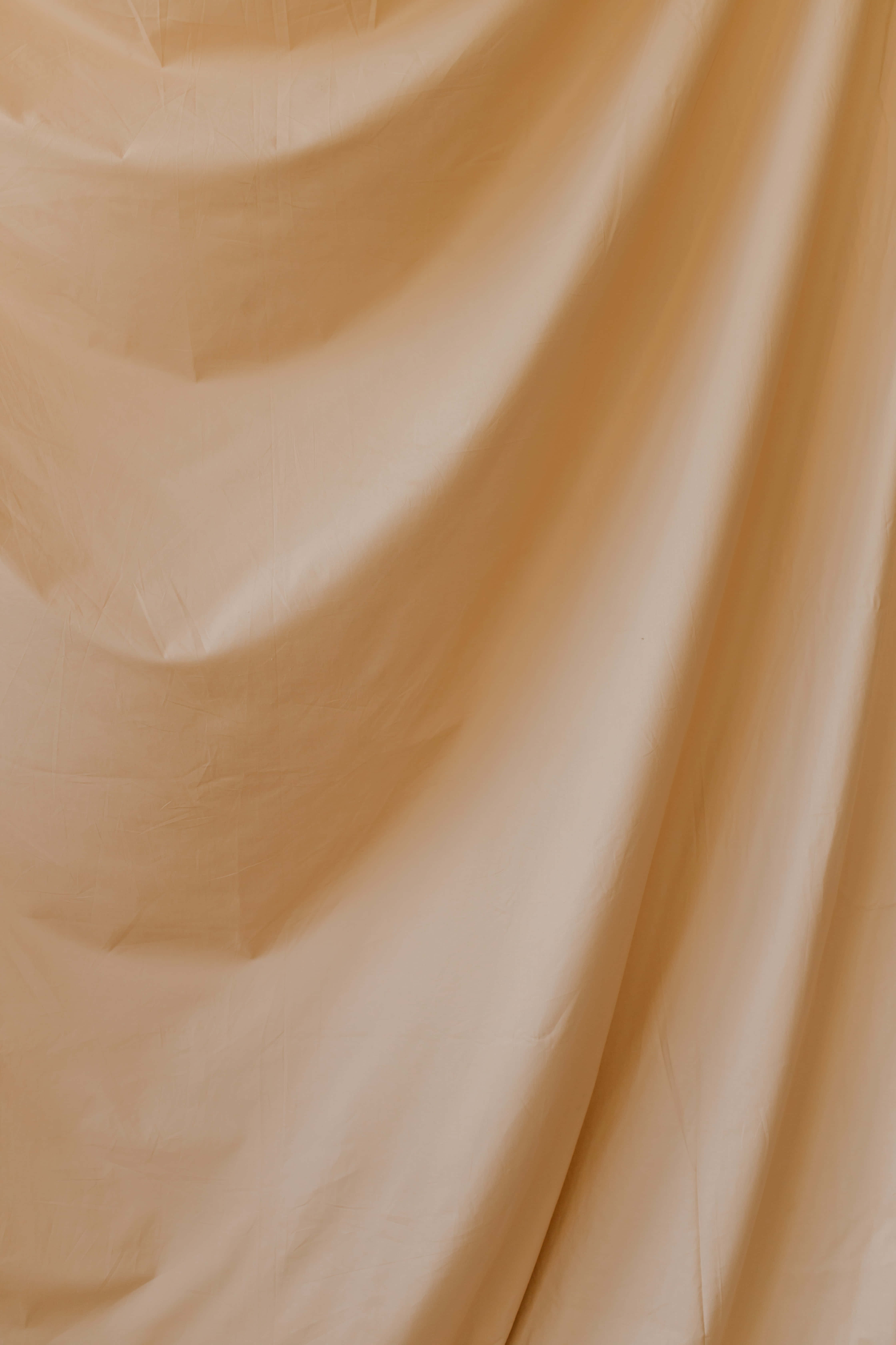 isang malapit na kuha ng isang beige na tela Wallpaper