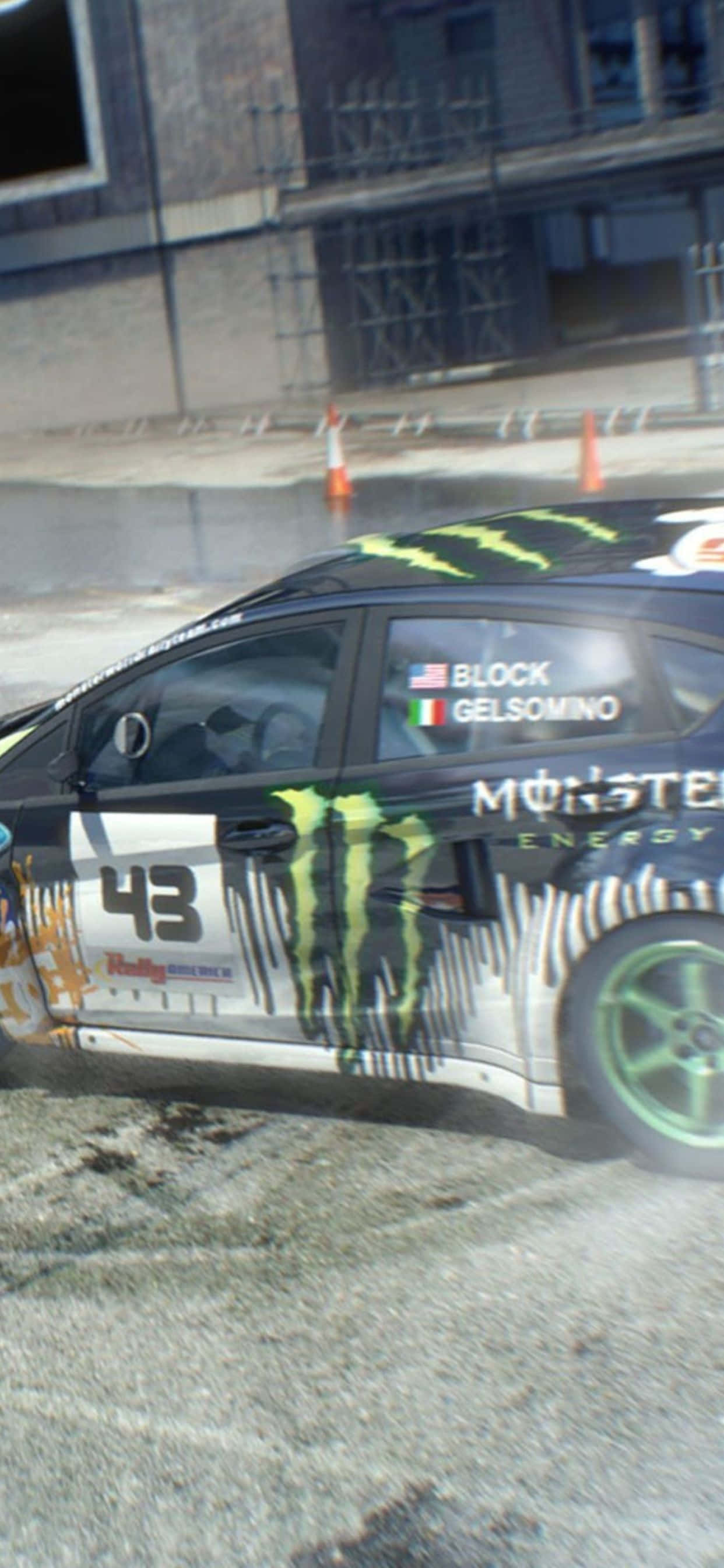 isang monster truck ay nagmamaneho sa isang kalye Wallpaper