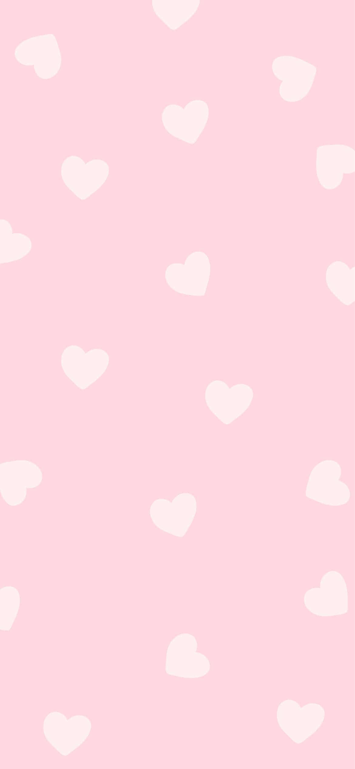 isang pink na background na may puting puso Wallpaper