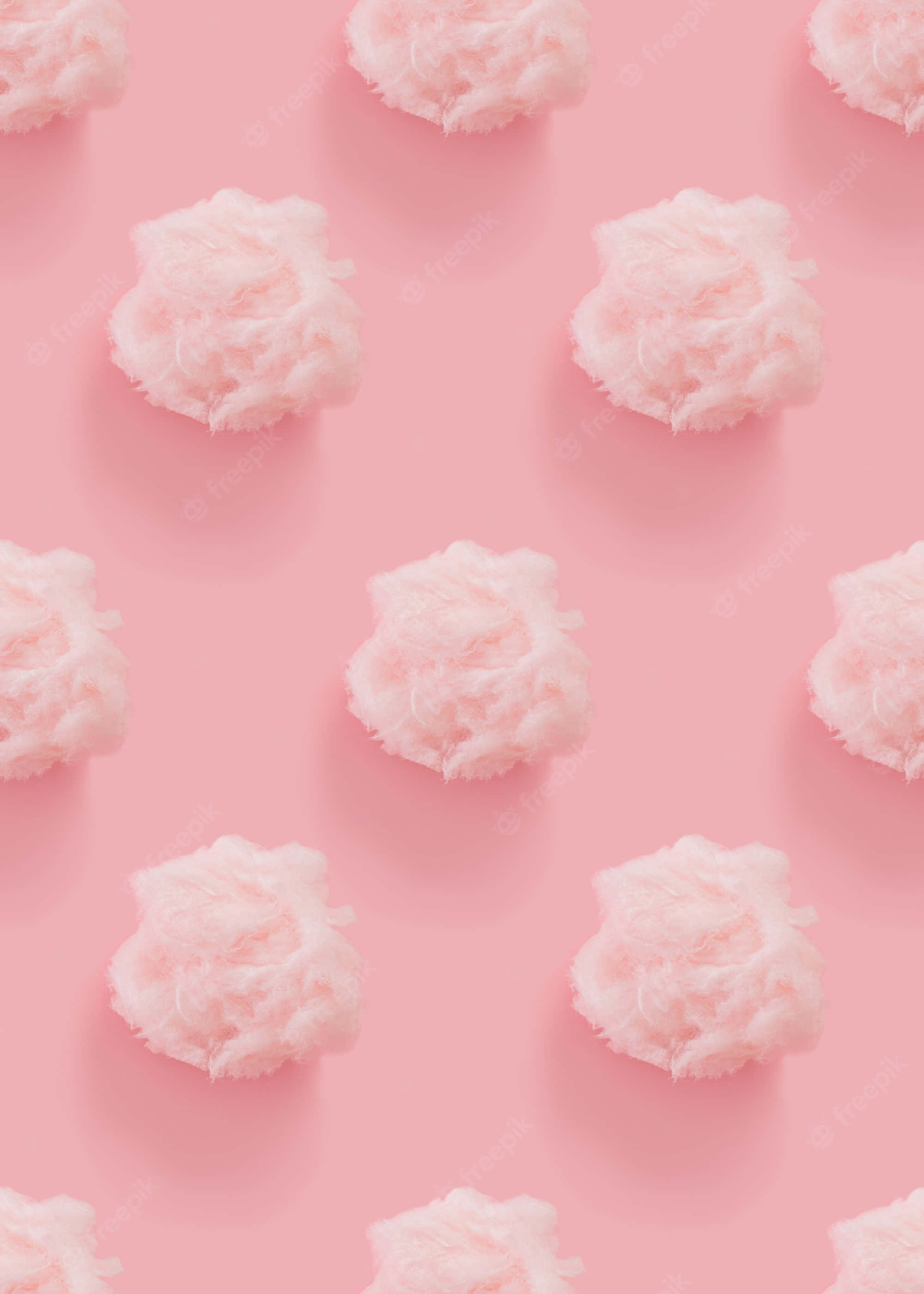 isang pink na background na may puting ulap dito Wallpaper