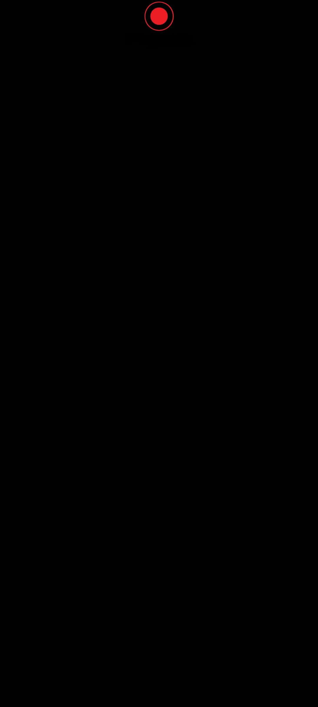 a red circle on a black background Wallpaper