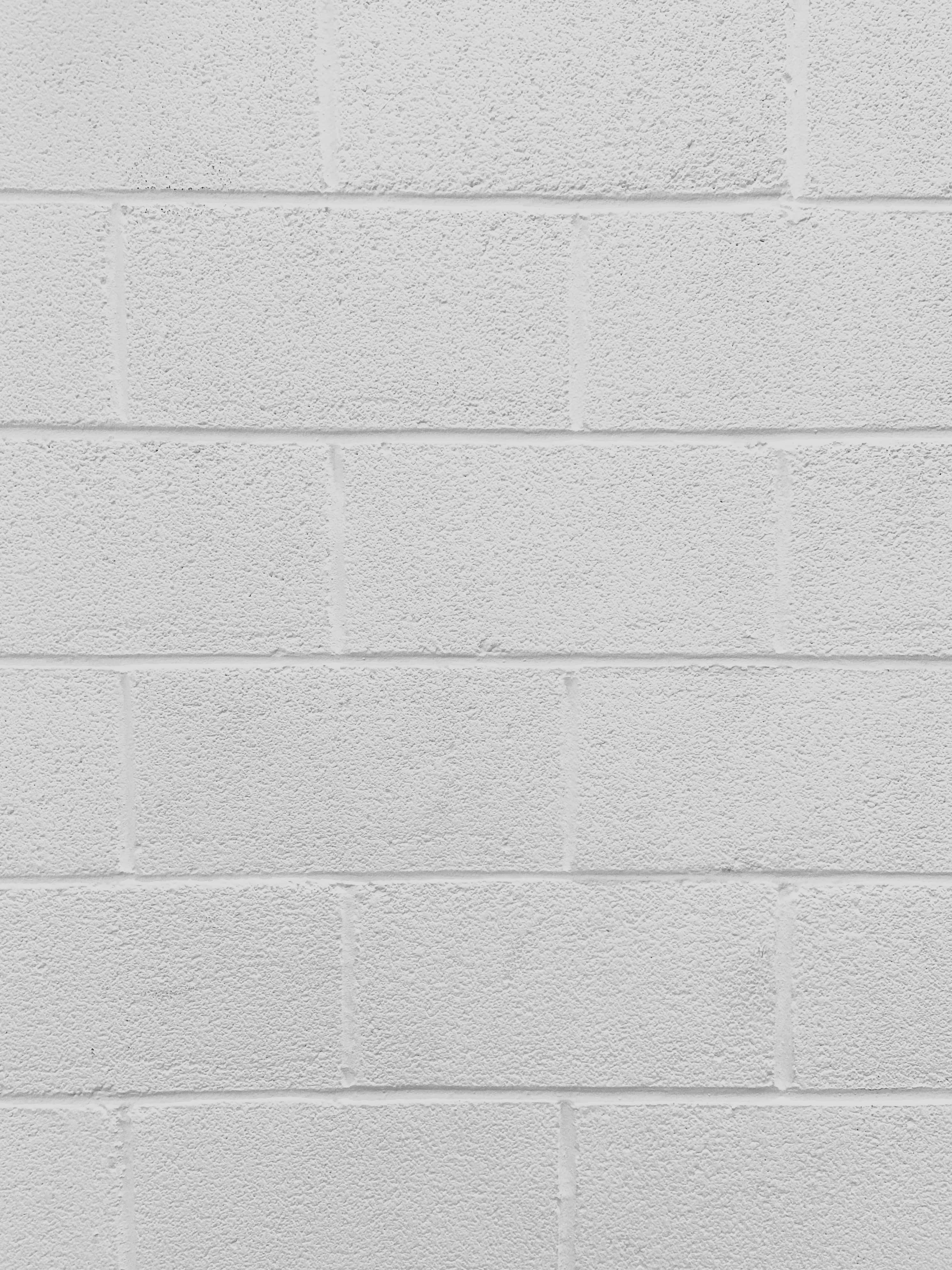 isang puting brick wall na may puting brick texture Wallpaper
