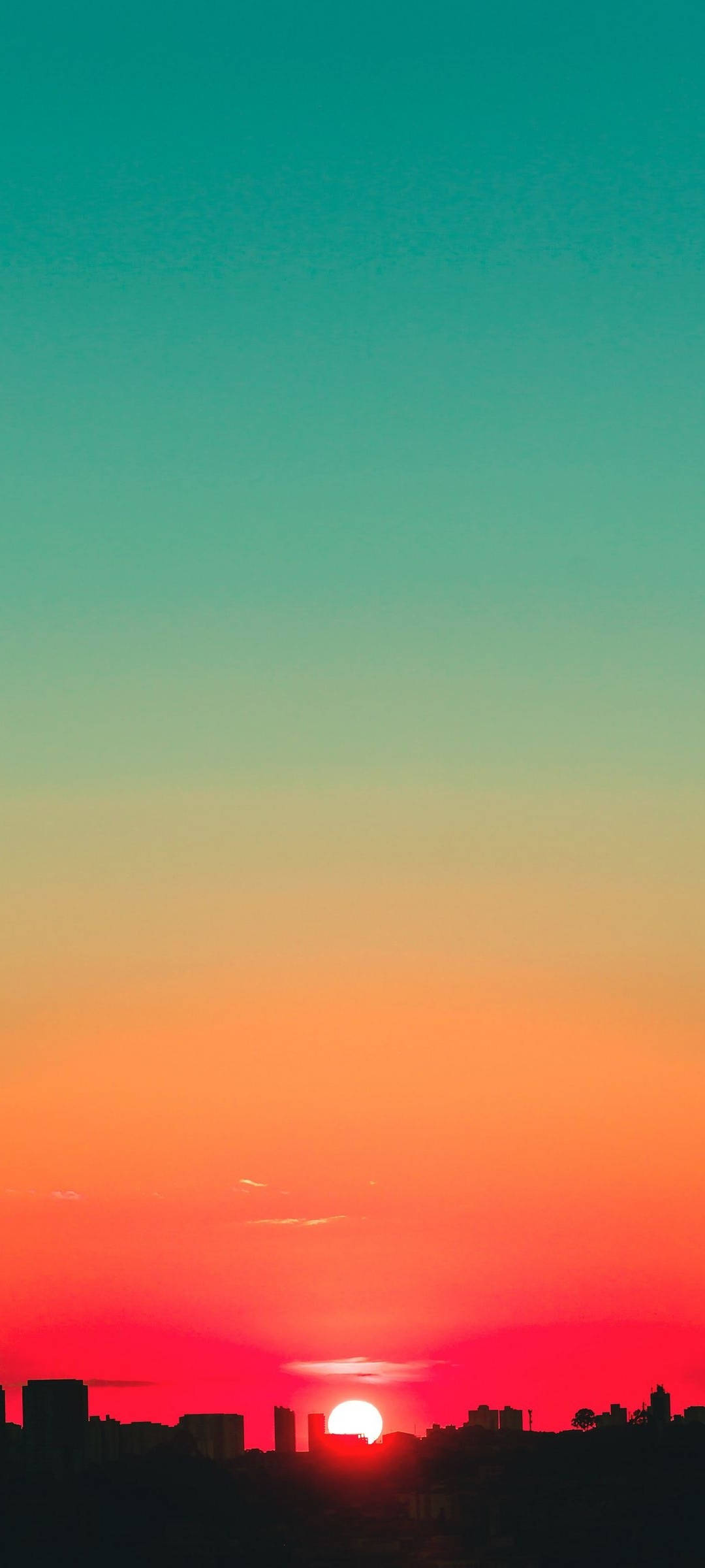 Kalangitan ng Teal at Pulang Paglubog Wallpaper
