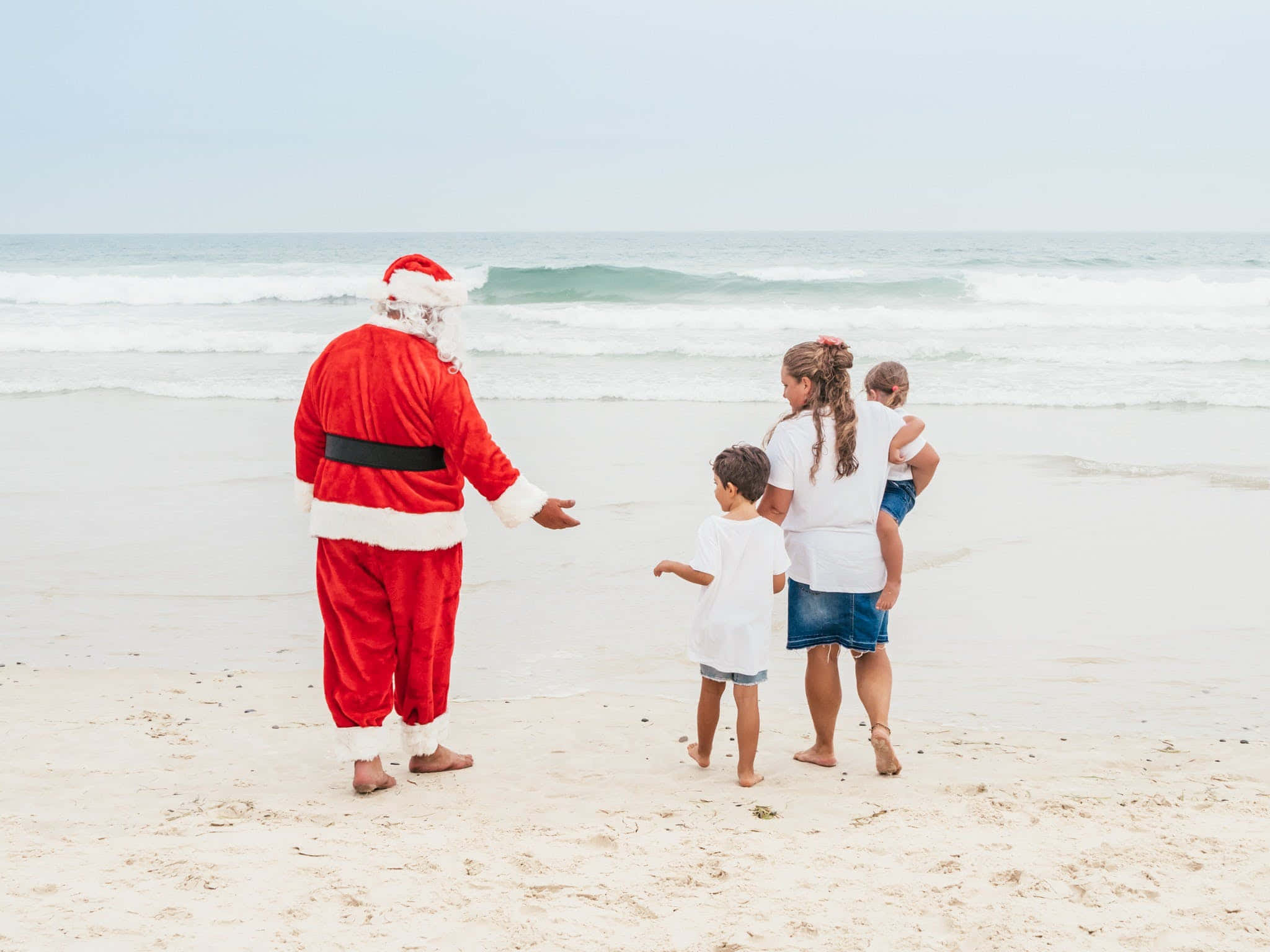Larawan ni Santa Sa Tabing-Dagat Para sa Pasko Wallpaper