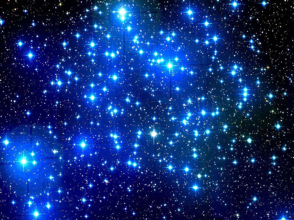 Makulay na Glow ng Dark Blue Star sa Kalawakan Wallpaper