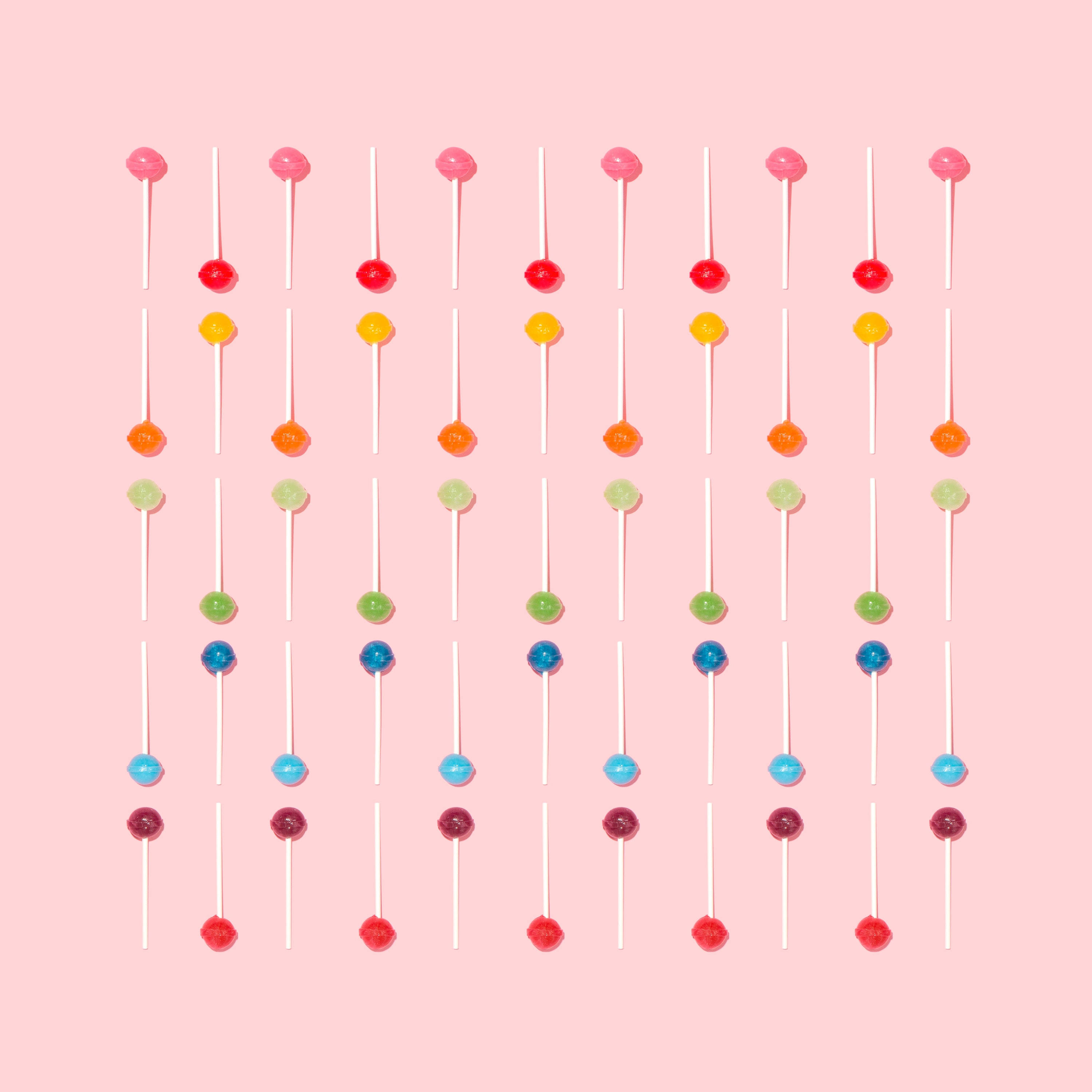 Masayang Disenyo ng Makukulay na Lollipop Wallpaper