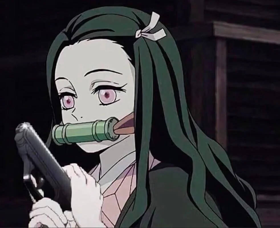 Nezuko Demon Slayer na may Baril Wallpaper