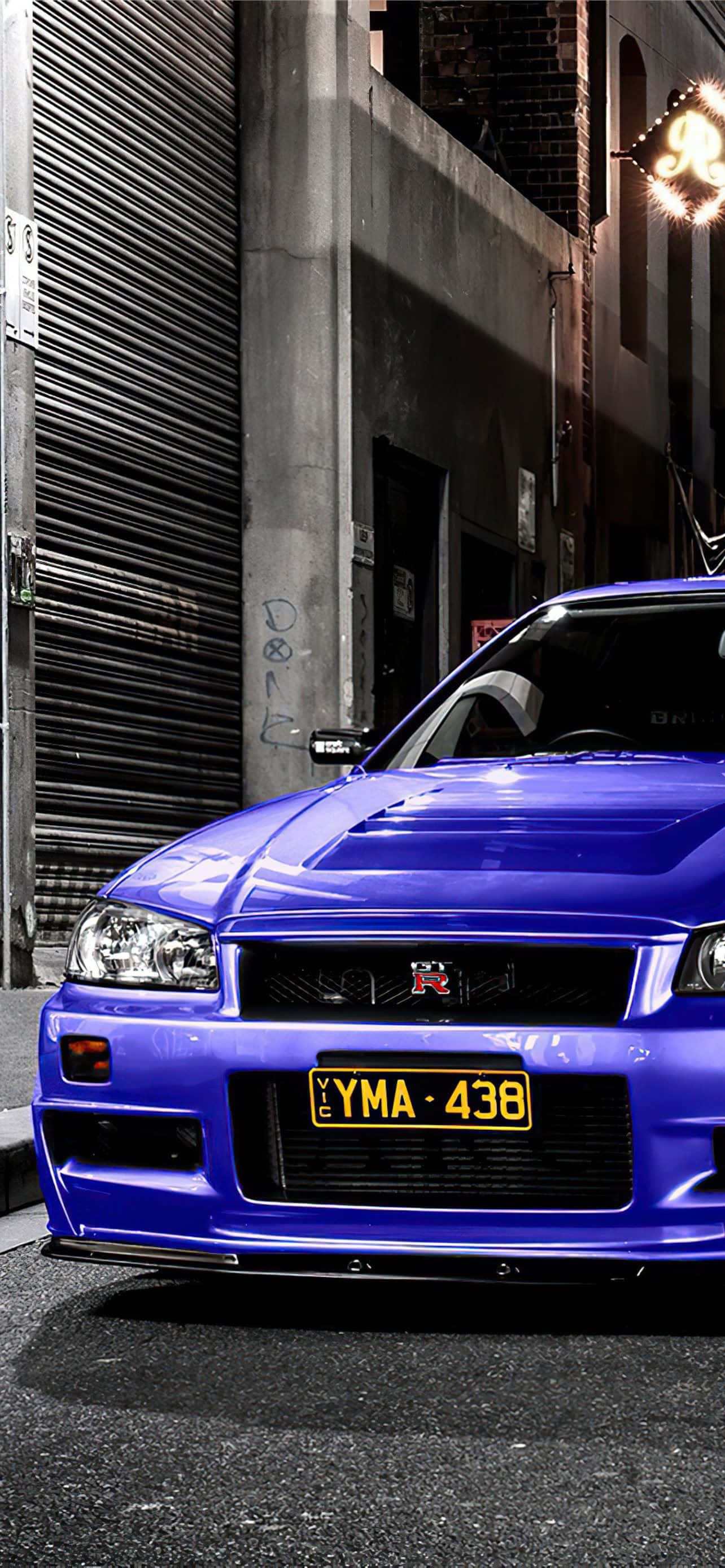 Pag-drive ng isang bagong level ng speed at style gamit ang Nissan Skyline iPhone. Wallpaper