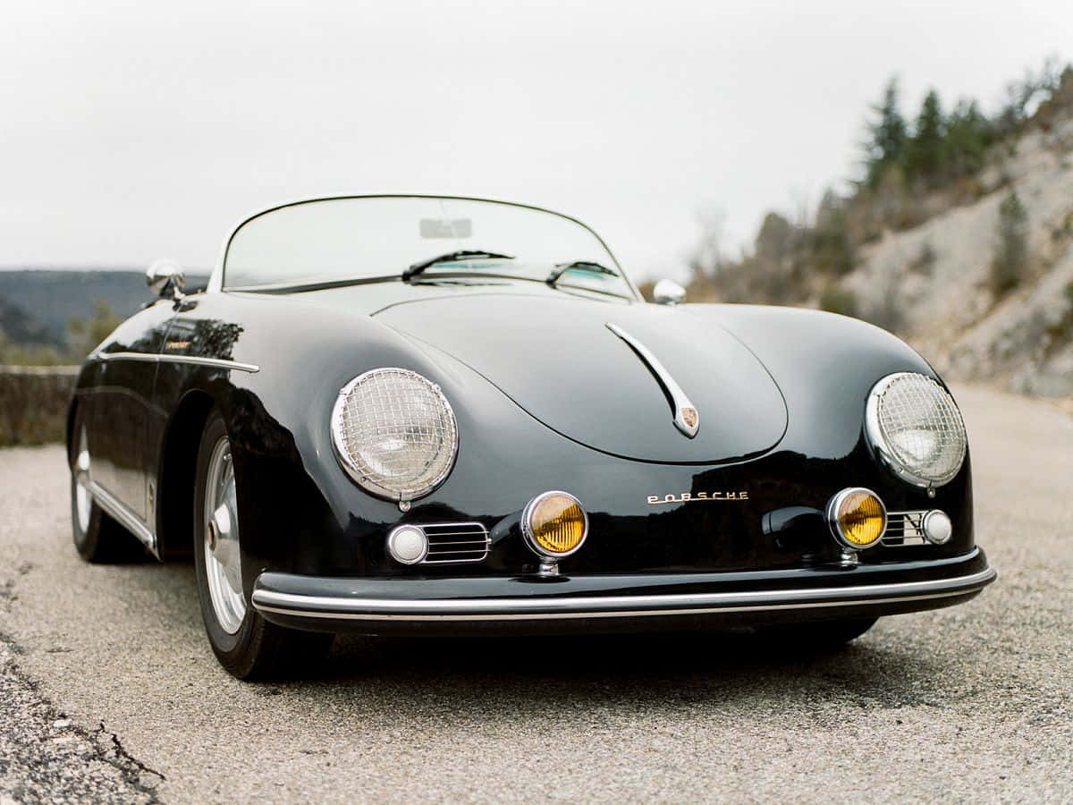 porsche 356 speedster - isang klasikong itim na sports car Wallpaper