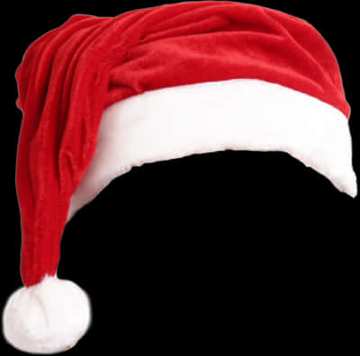 Pulang Sombrero ni Santa na Naka-Isolate sa Itim na Background Wallpaper