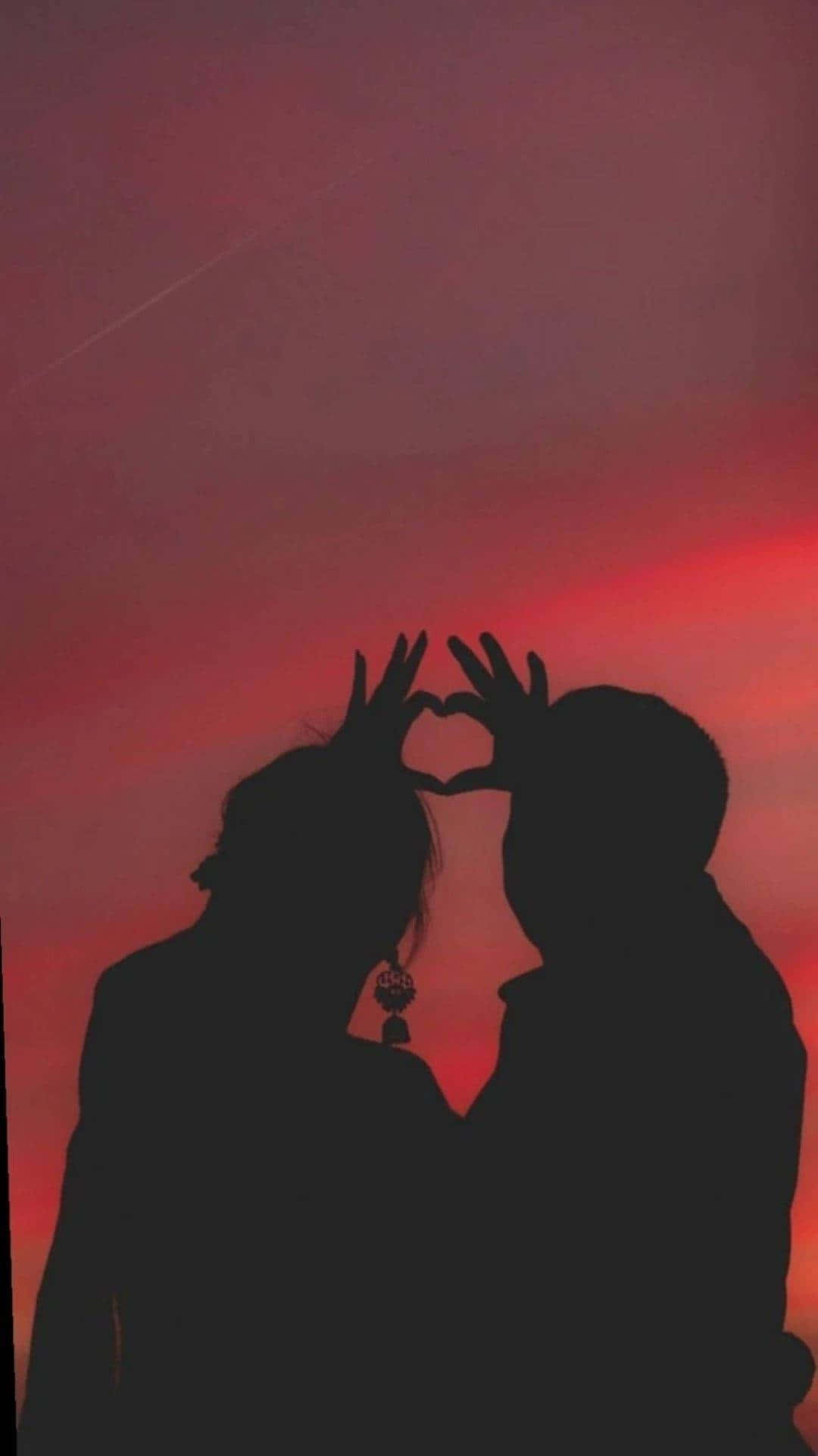 Relasyon ng Magandang Magkasintahan na Nag-eenjoy sa Paglubog ng Araw Wallpaper