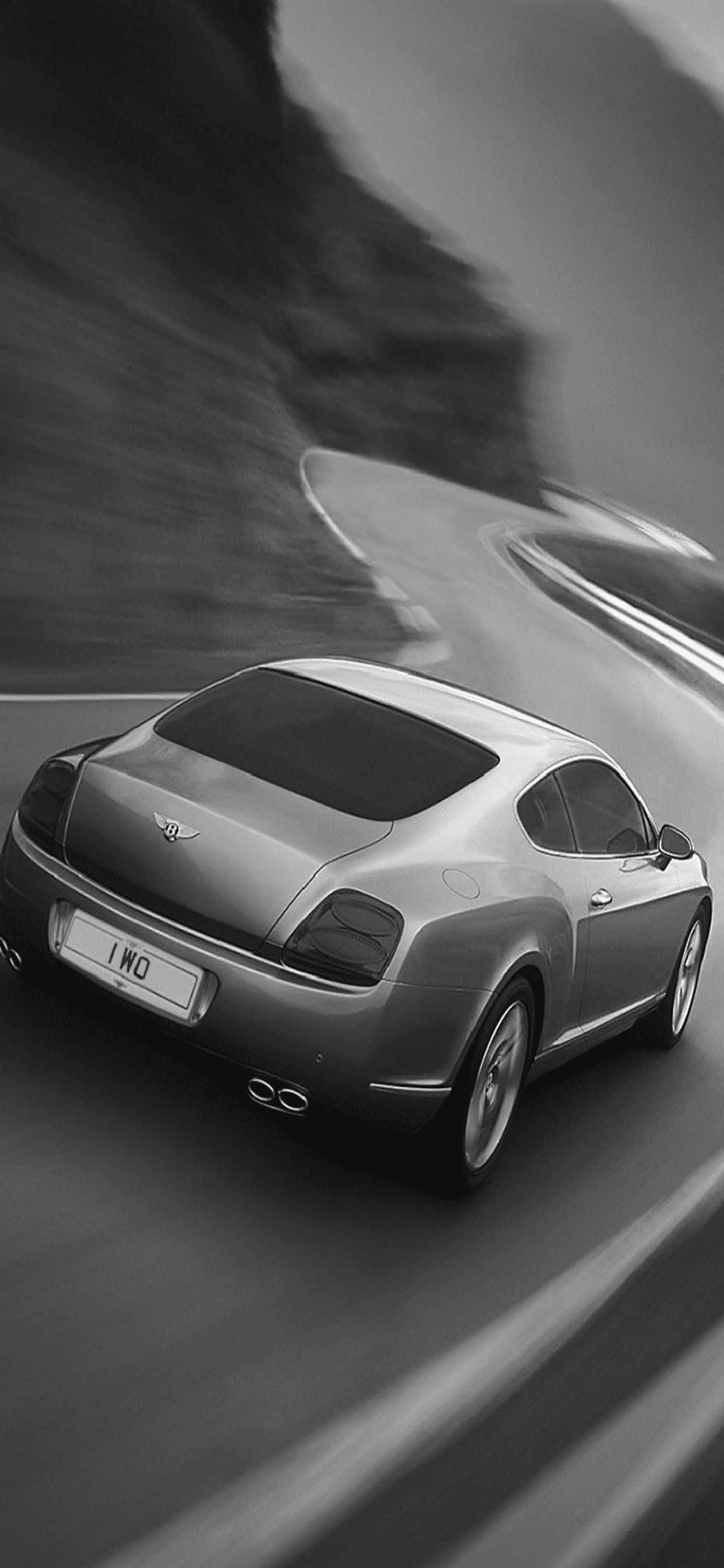Sumakay at maranasan ang nakatataas na karilagan sa iPhone Xs Max Bentley Wallpaper