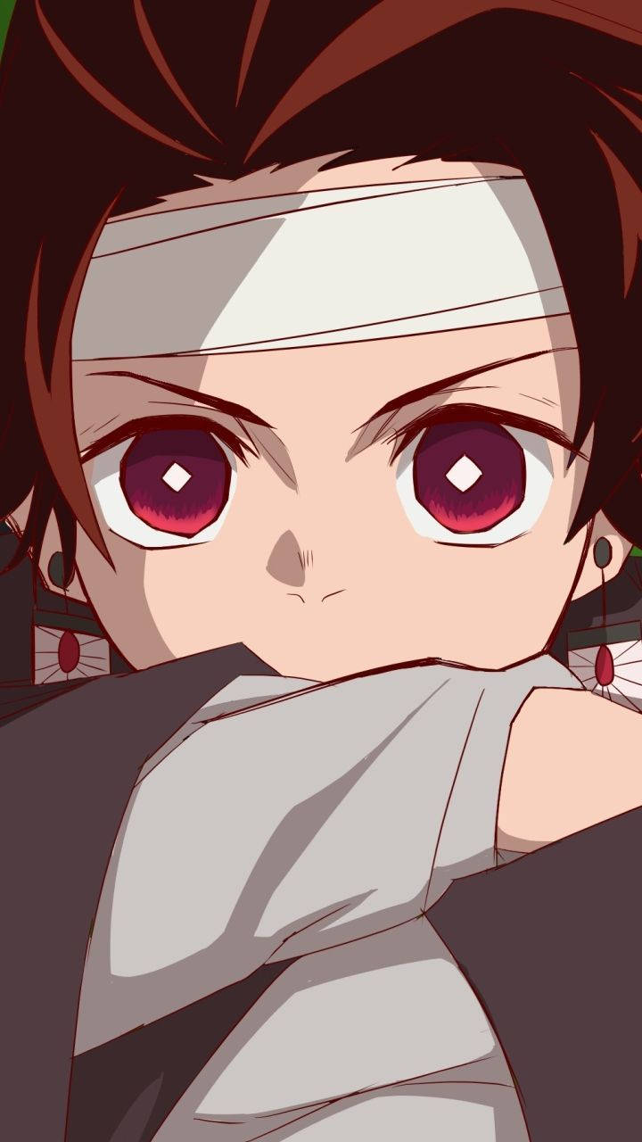 Tanjiro, isang batang mandirigma, lumalaban sa mga demonyo gamit ang kanyang katana Wallpaper
