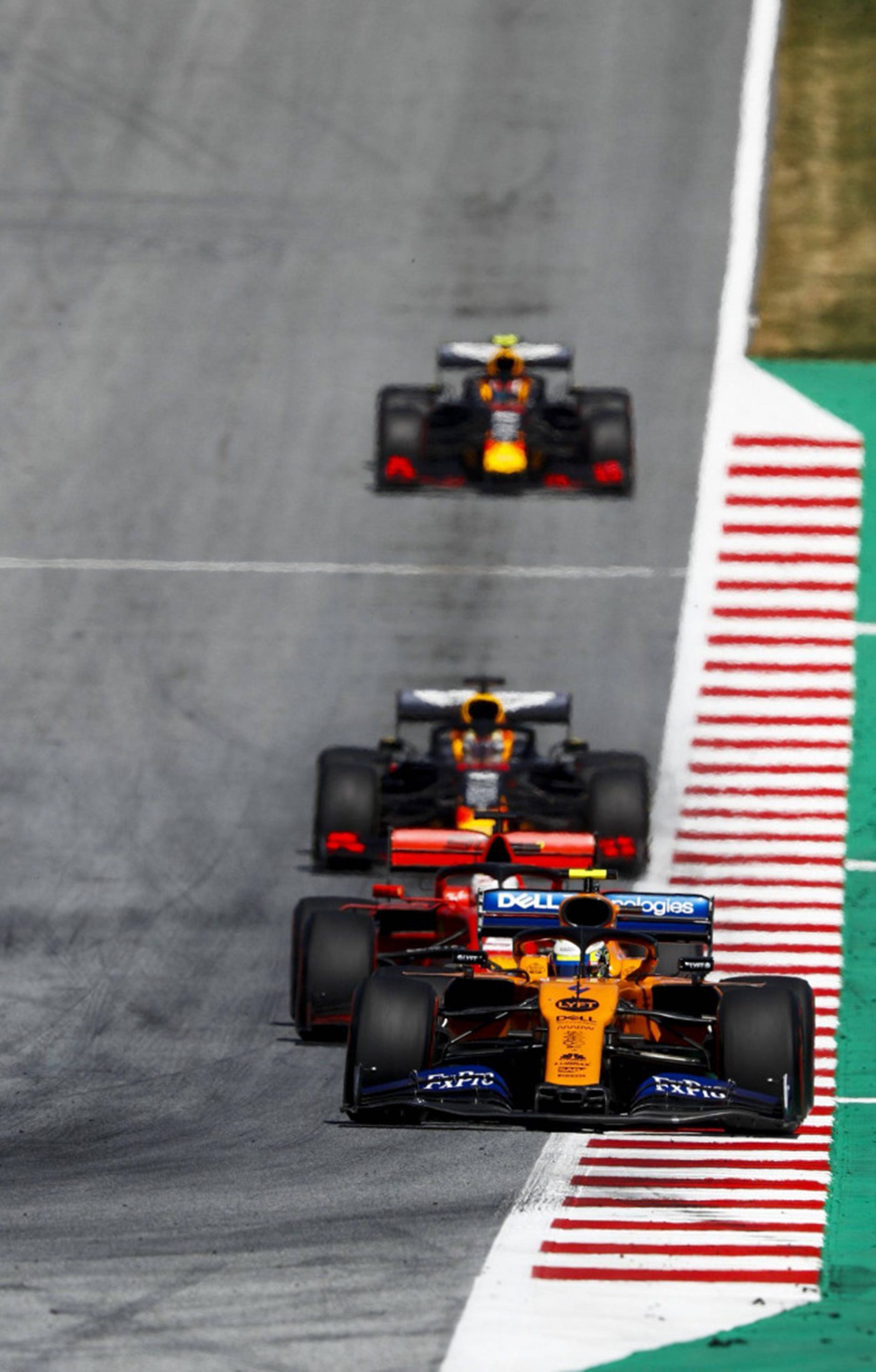 Thrill of Speed - F1 Phone in Action Wallpaper