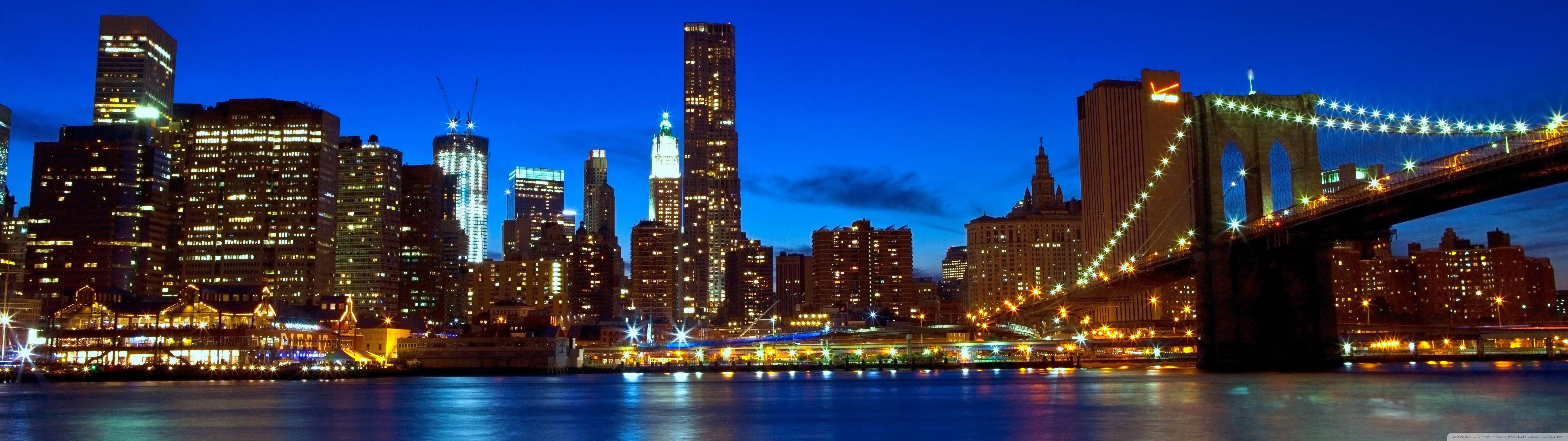 Masiglang Tanawin ng Manhattan sa Panahon ng Paglubog ng Araw Wallpaper