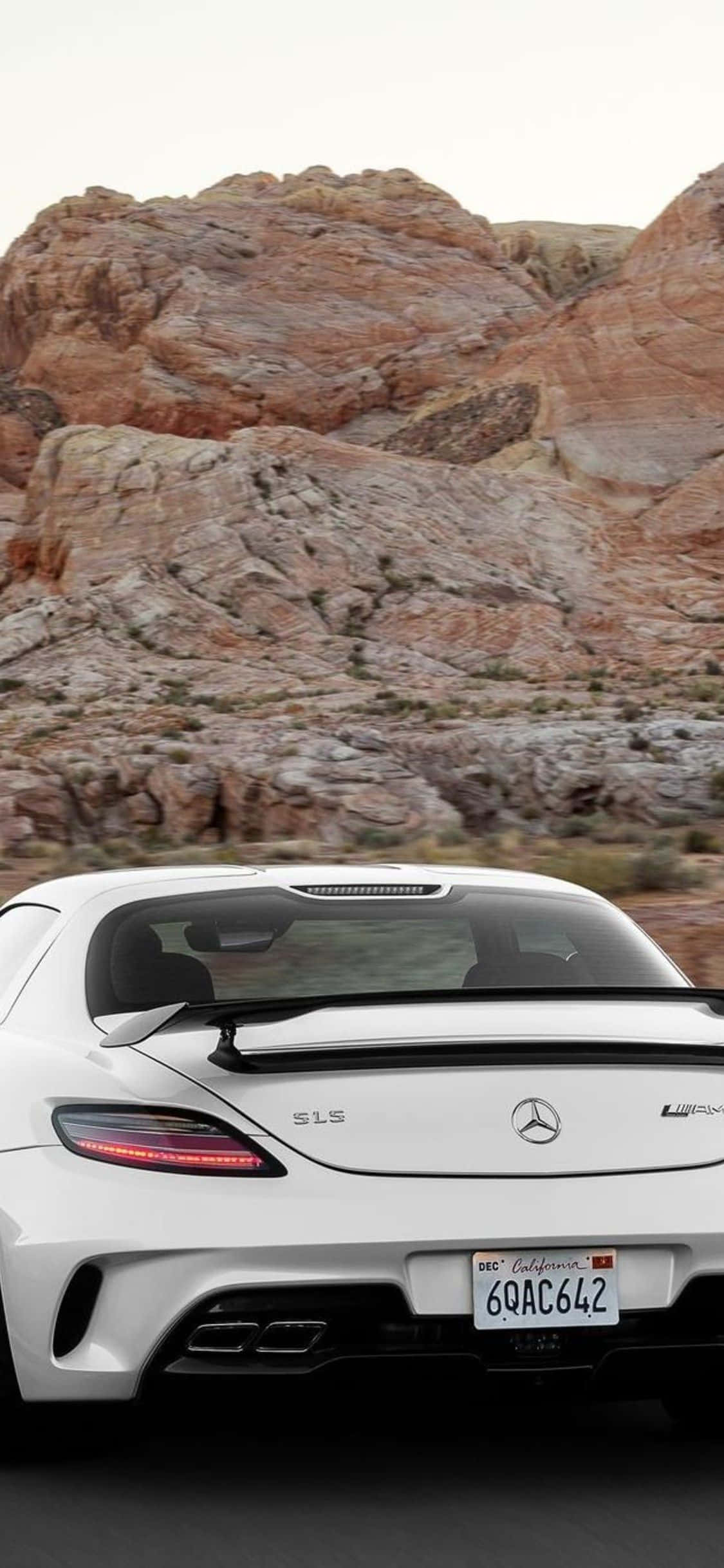 White iPhone Xs Mercedes Amg Background Rocky Mountain Wallpaper