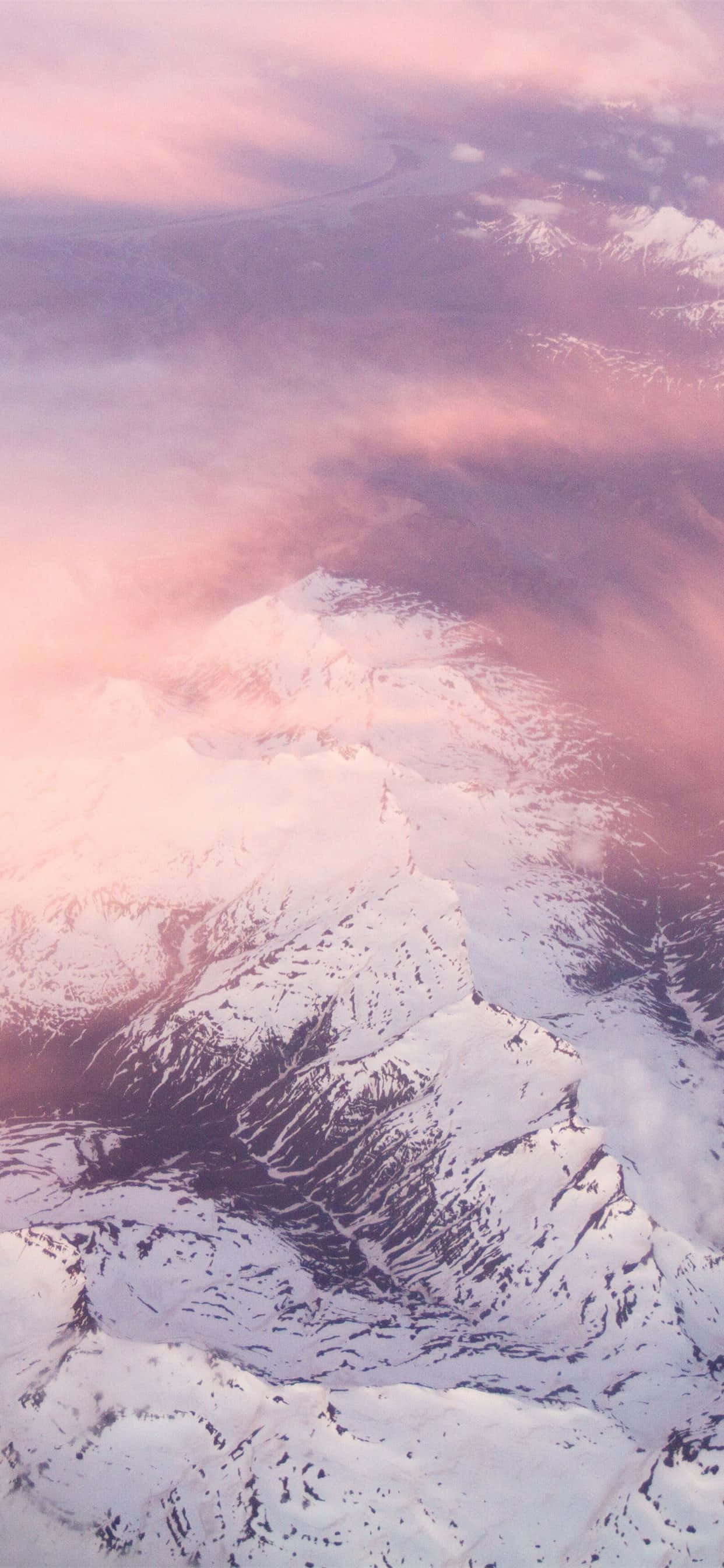 White Mountain Under Pink Clouds Background Wallpaper