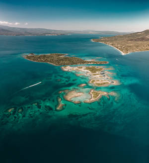 Small island in the middle of the ocean in Greece wallpaper — Nubia Fold Wallpaper