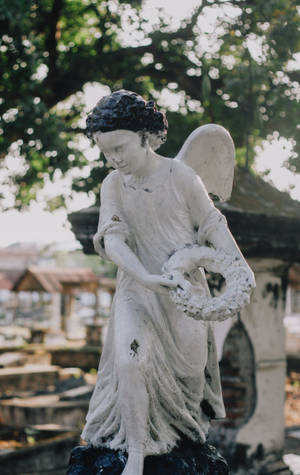 Wallpaper ng angel child statue — RedMagic Tablet Wallpaper