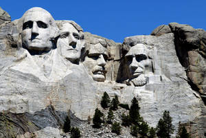 Araw na Sumisikat sa Mount Rushmore — Asul na Langit Wallpaper