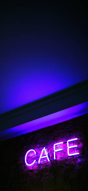 Neon Purple Iphone Cafe Light — Pixel 10 Pro XL Wallpaper